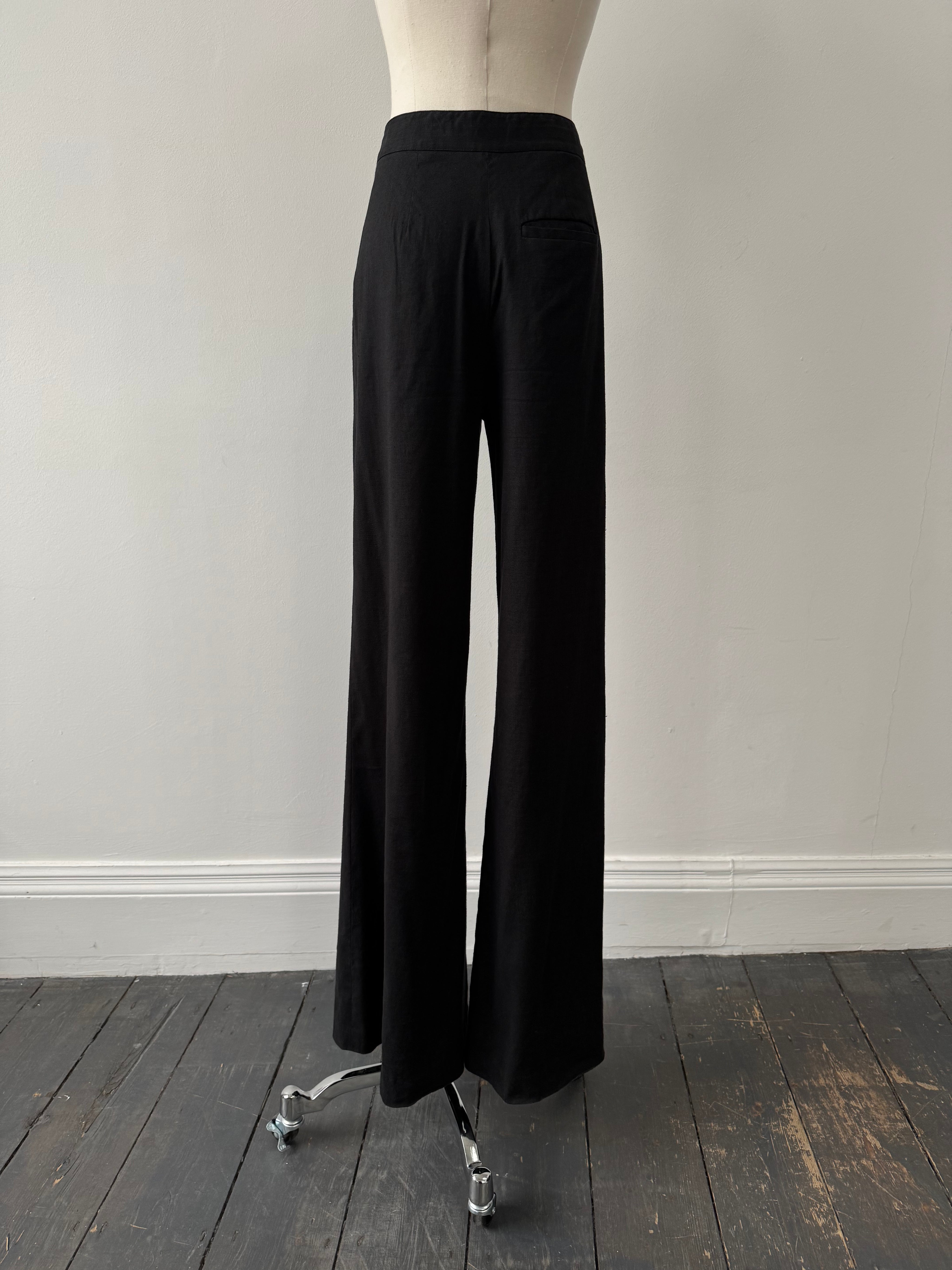 Diane Von Furstenberg 2000s linen wide-leg trousers in W24, showing beige fabric, high waist, and relaxed fit.