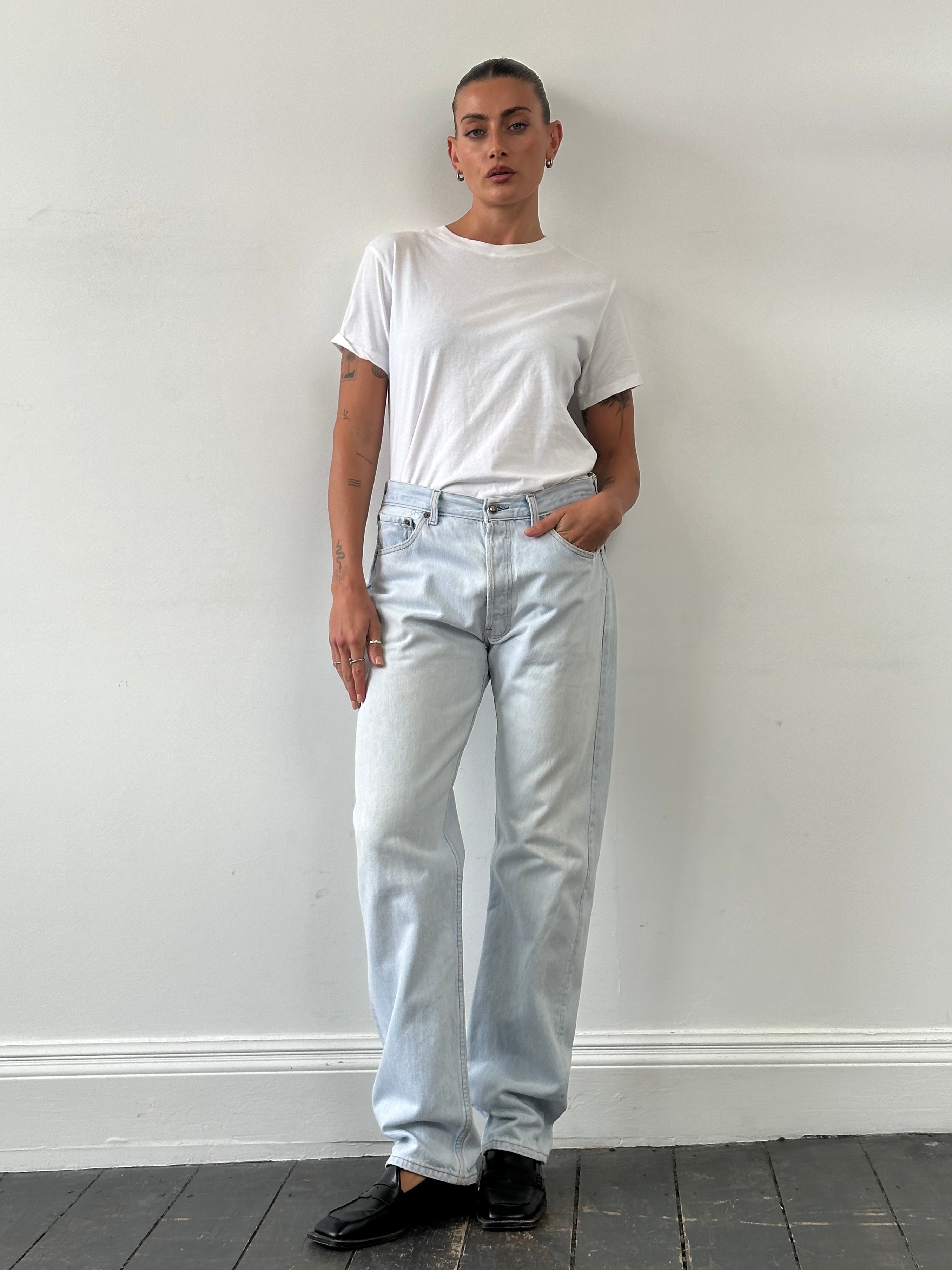 Levi’s 501 light wash straight leg denim jeans, W30, showing front view with classic five-pocket design and button fly.