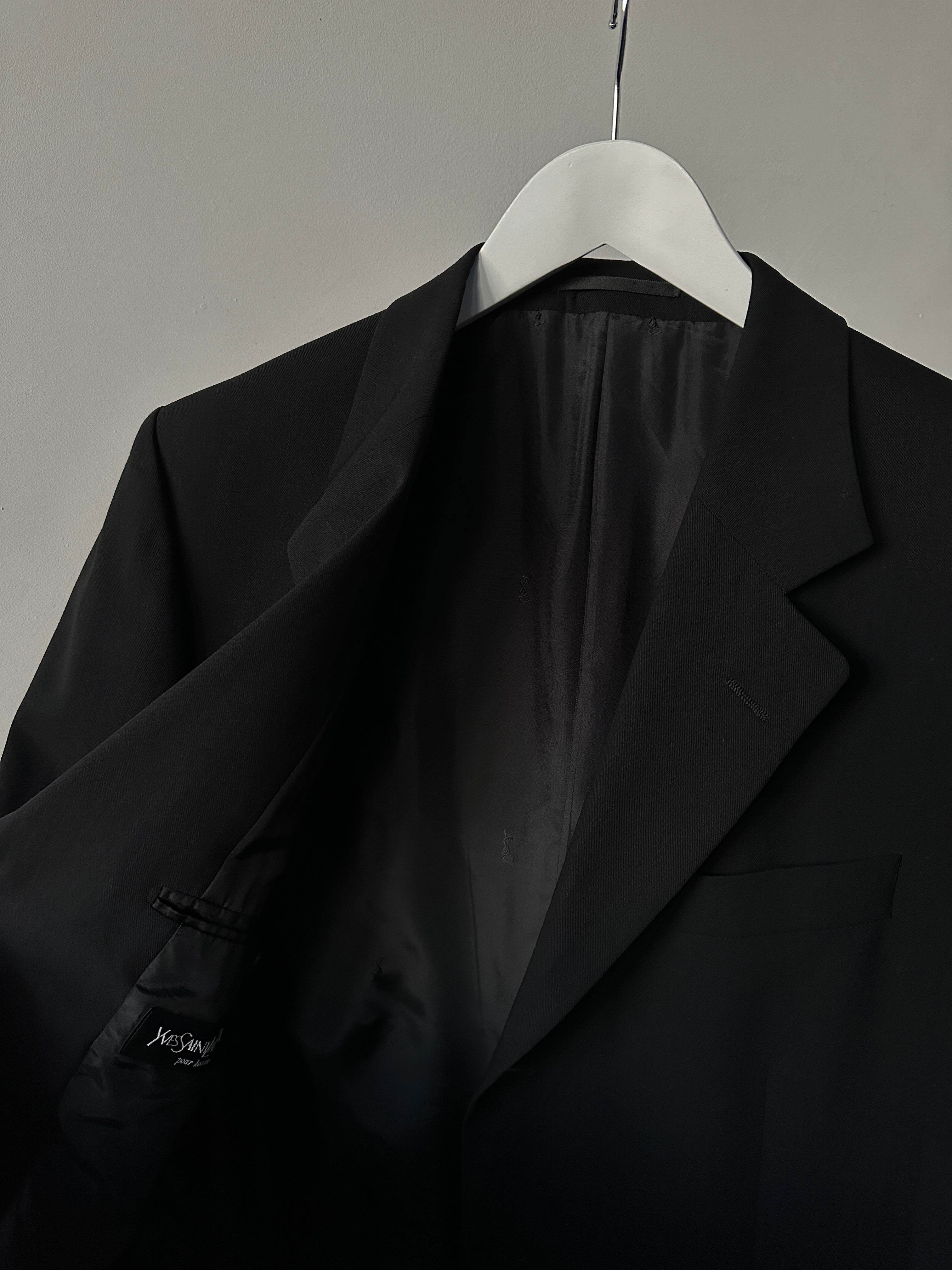 Yves Saint Laurent pure wool jumpsuit in size 42R/W32, tailored fit with long sleeves and classic collar, in a sleek black color.