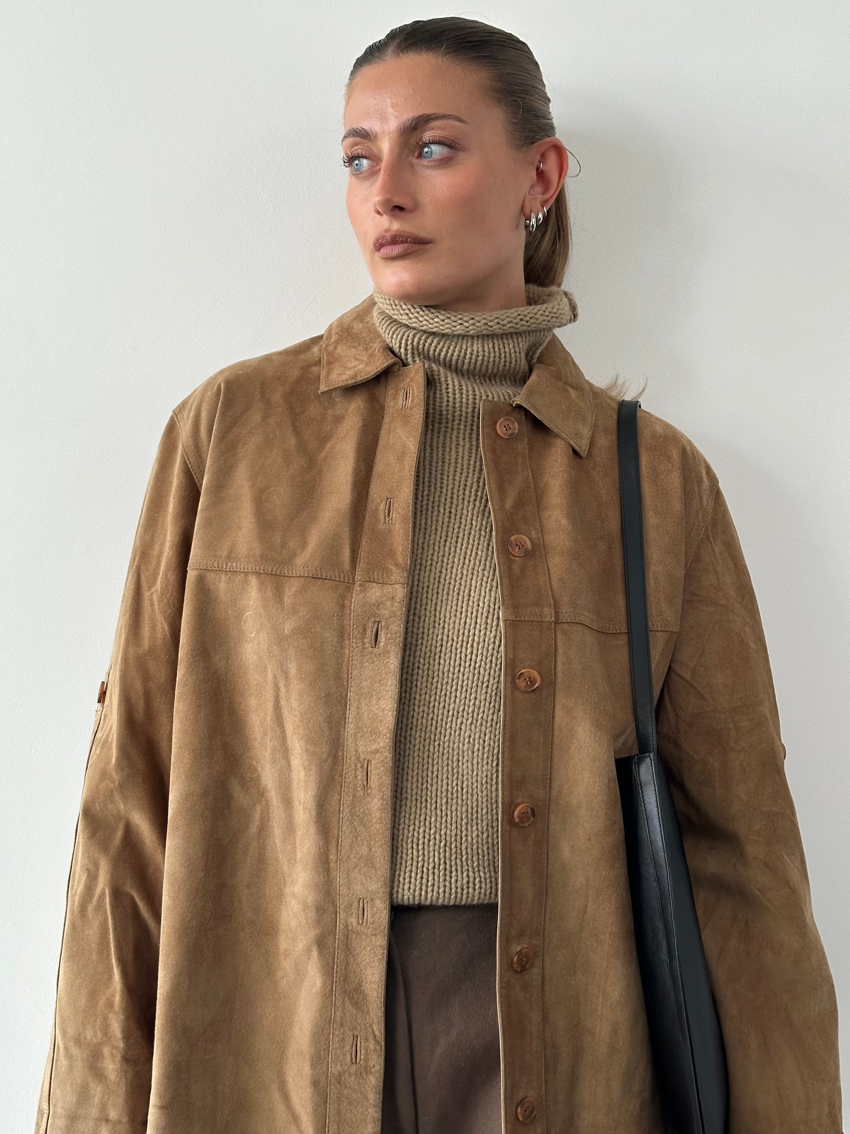 Vintage suede shirt in size large, featuring a classic design with soft suede material and detailed stitching.