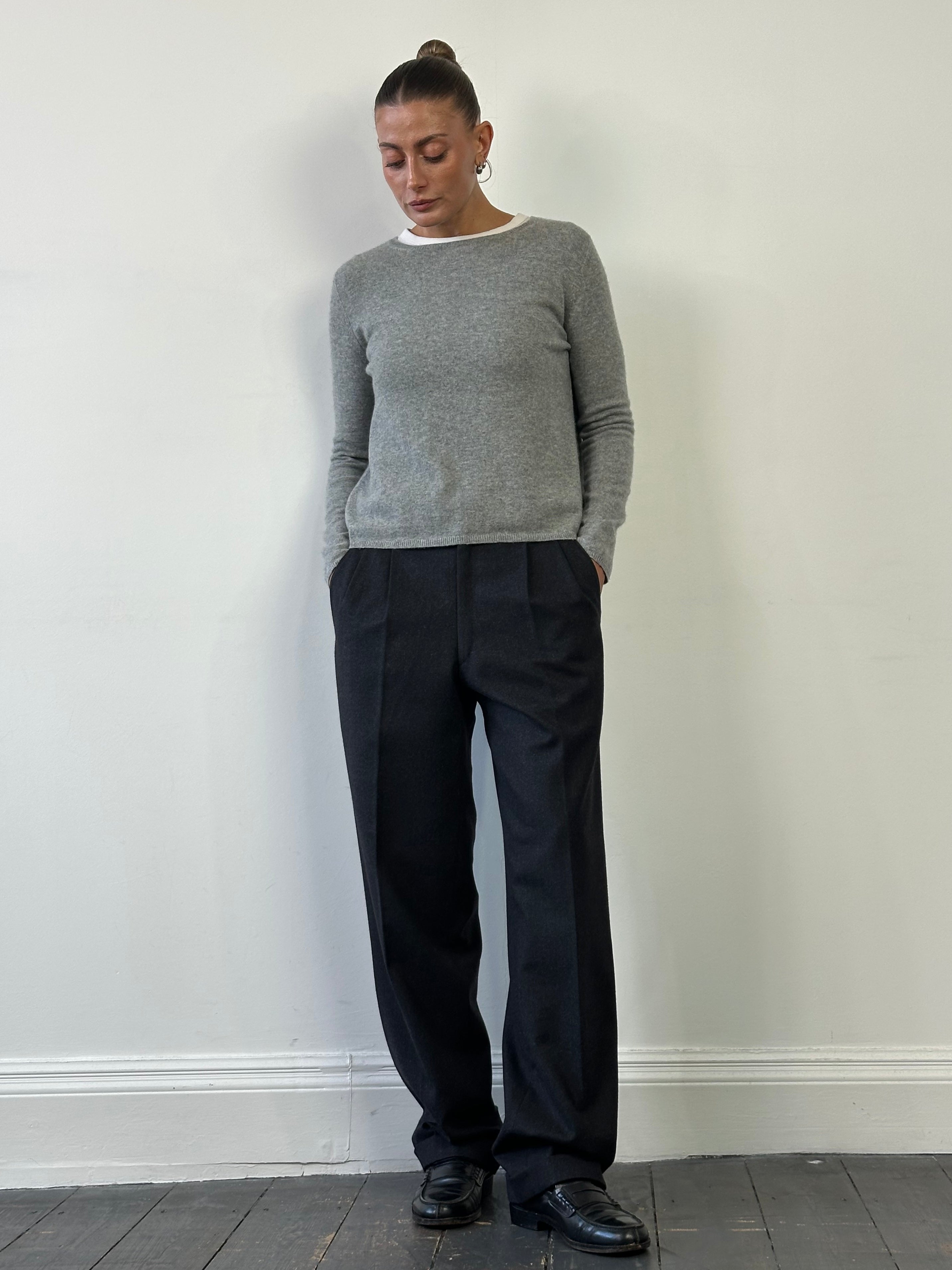 Italian vintage 90s pure wool tailored trousers in size W32, featuring a classic fit with a sharp crease and belt loops.