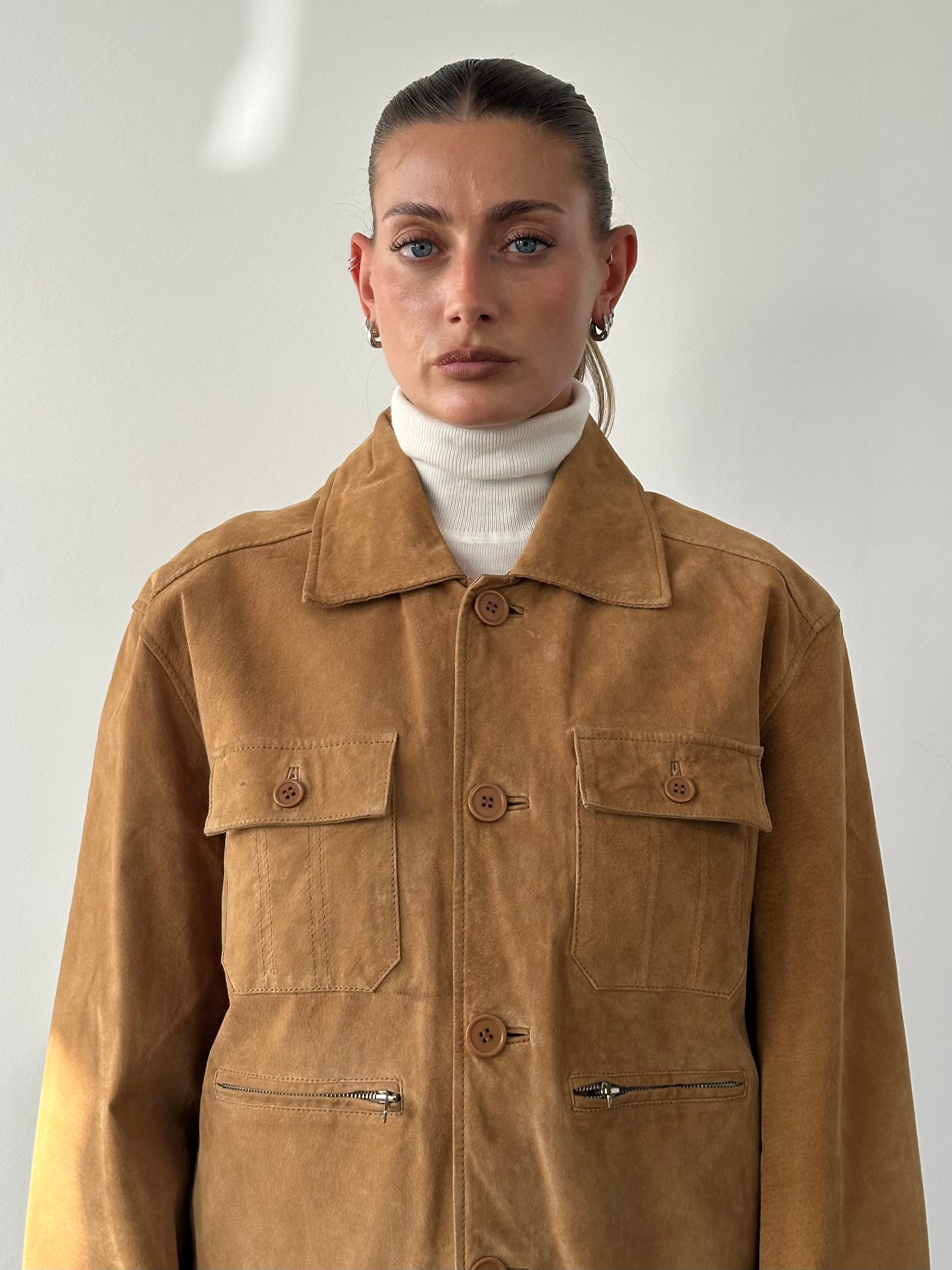 Vintage suede trucker jacket in size M/L, featuring classic design and detailed stitching, shown on a hanger.