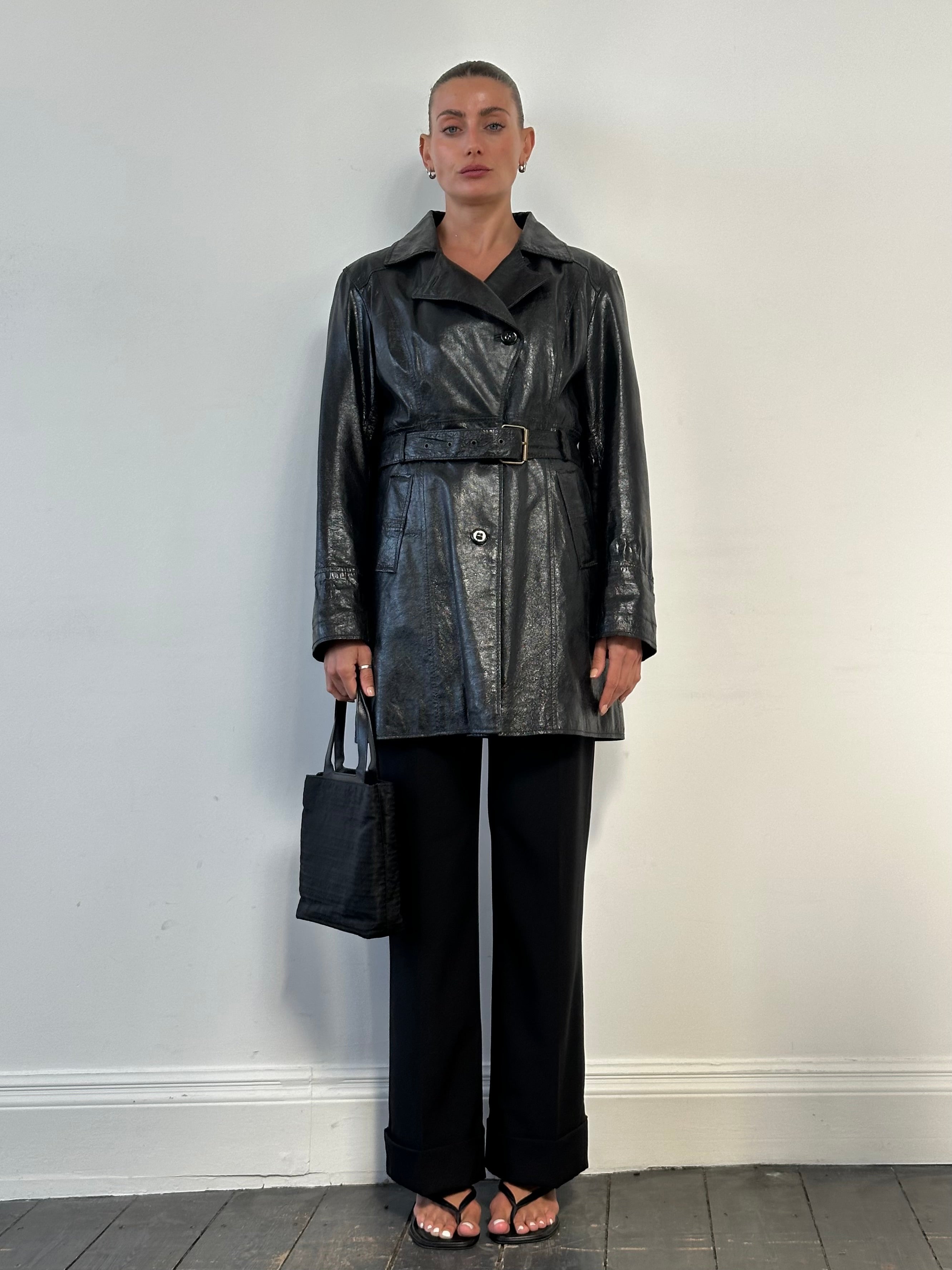 Conbipel leather belted trench coat in medium size, stylish jacket with a classic design and leather accents.