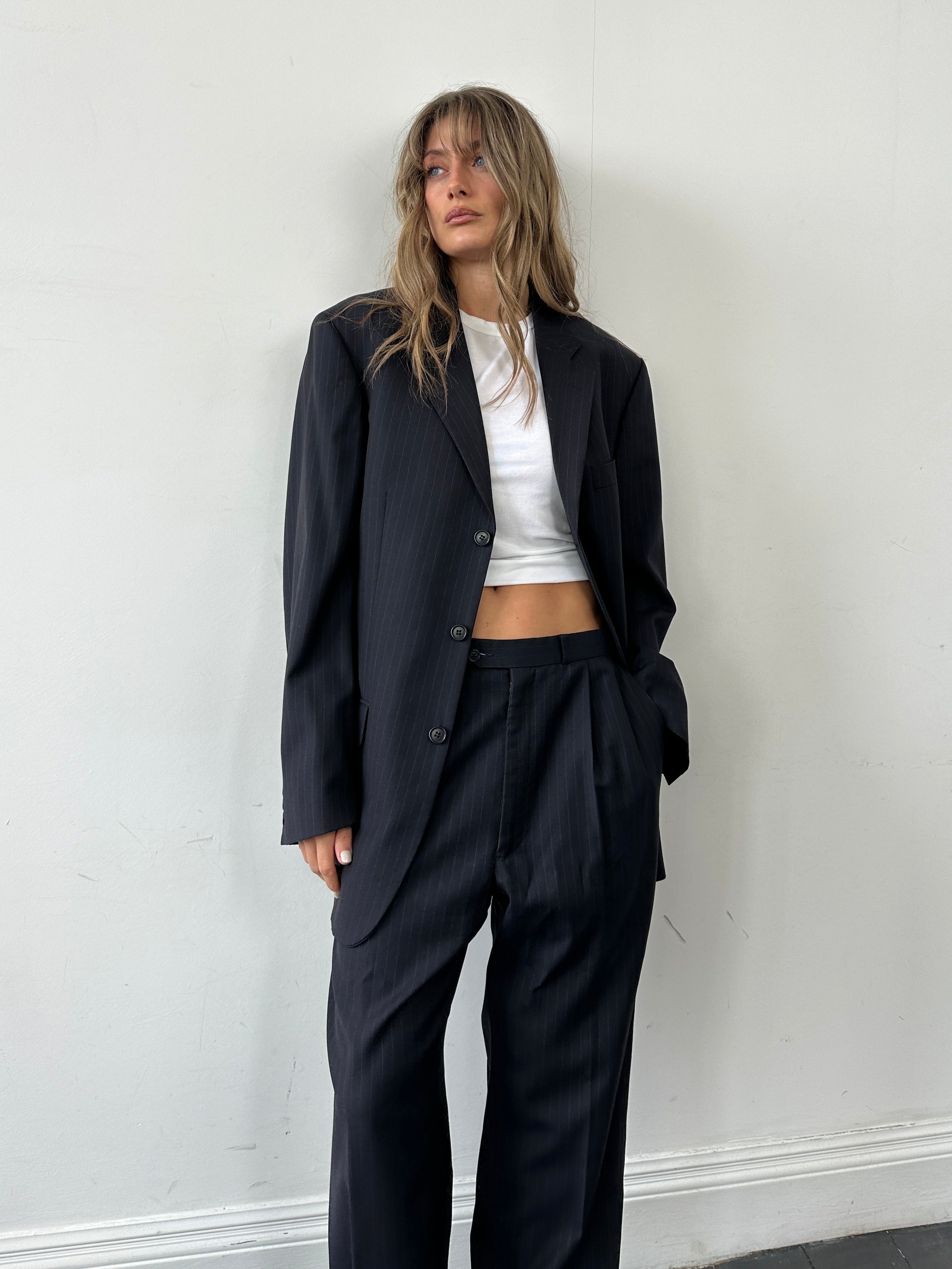 Balmain pinstripe pure wool single-breasted jumpsuit in size 40L/W32, featuring tailored lapels and a sleek fit.