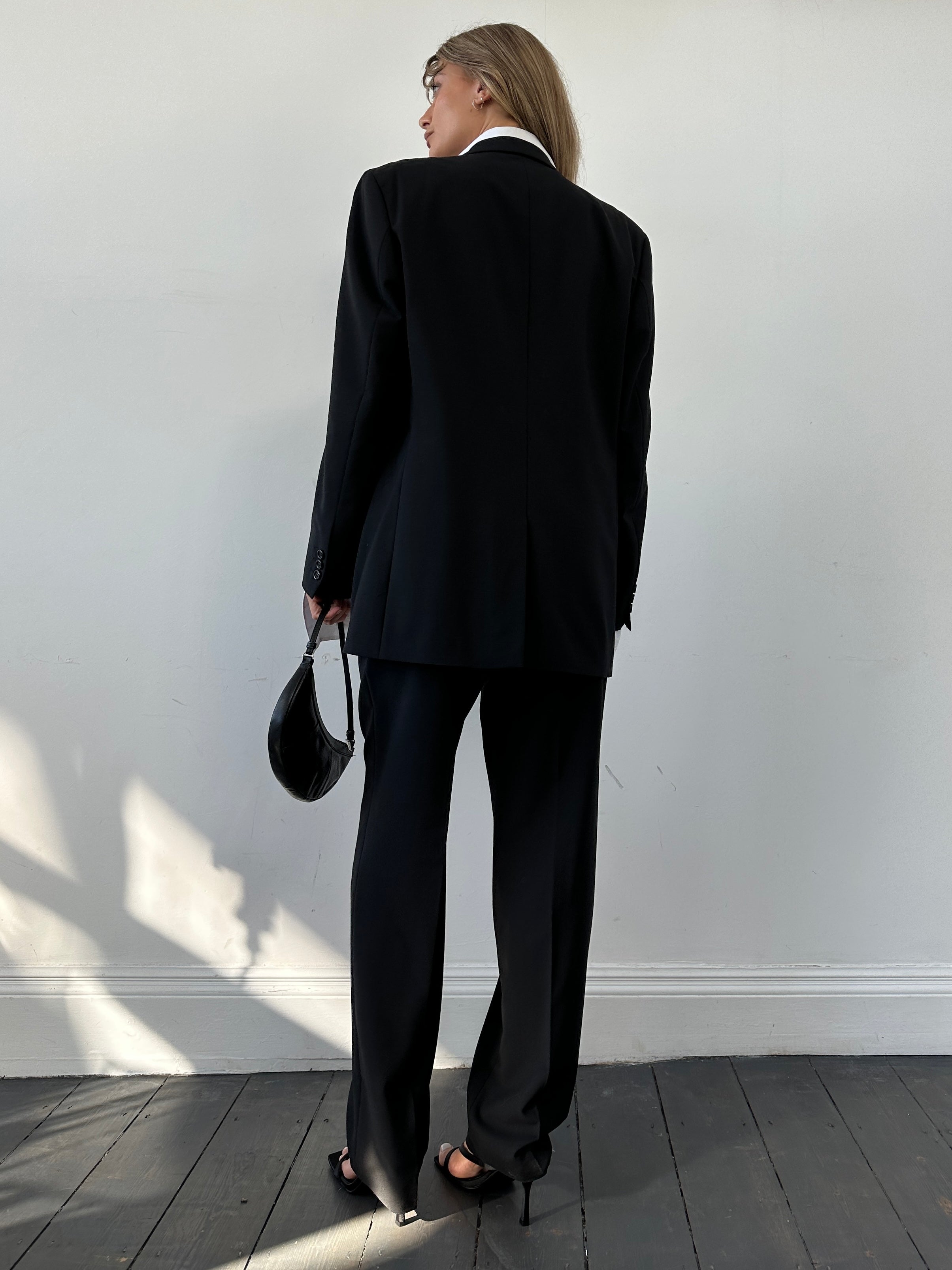 Vintage relaxed suit jumpsuit with concealed placket, in size 40R/L, featuring a vintage-inspired design and comfortable fit.