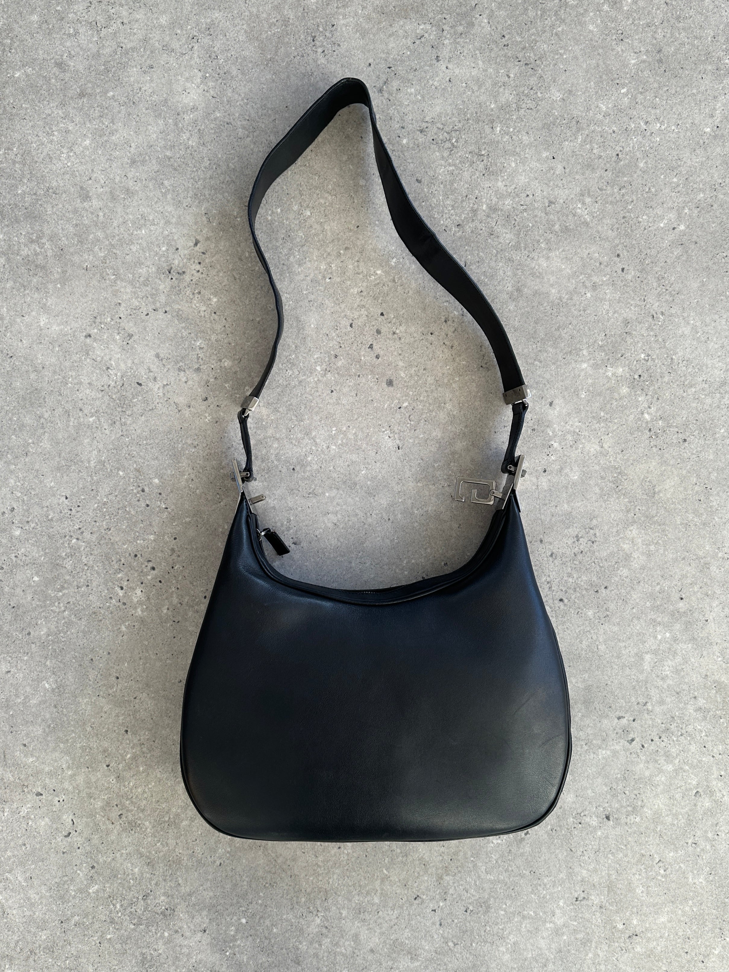 Gucci 1990s Tom Ford GG 3-in-1 leather attache bag with handles and compartments, featuring signature monogram and structured design.