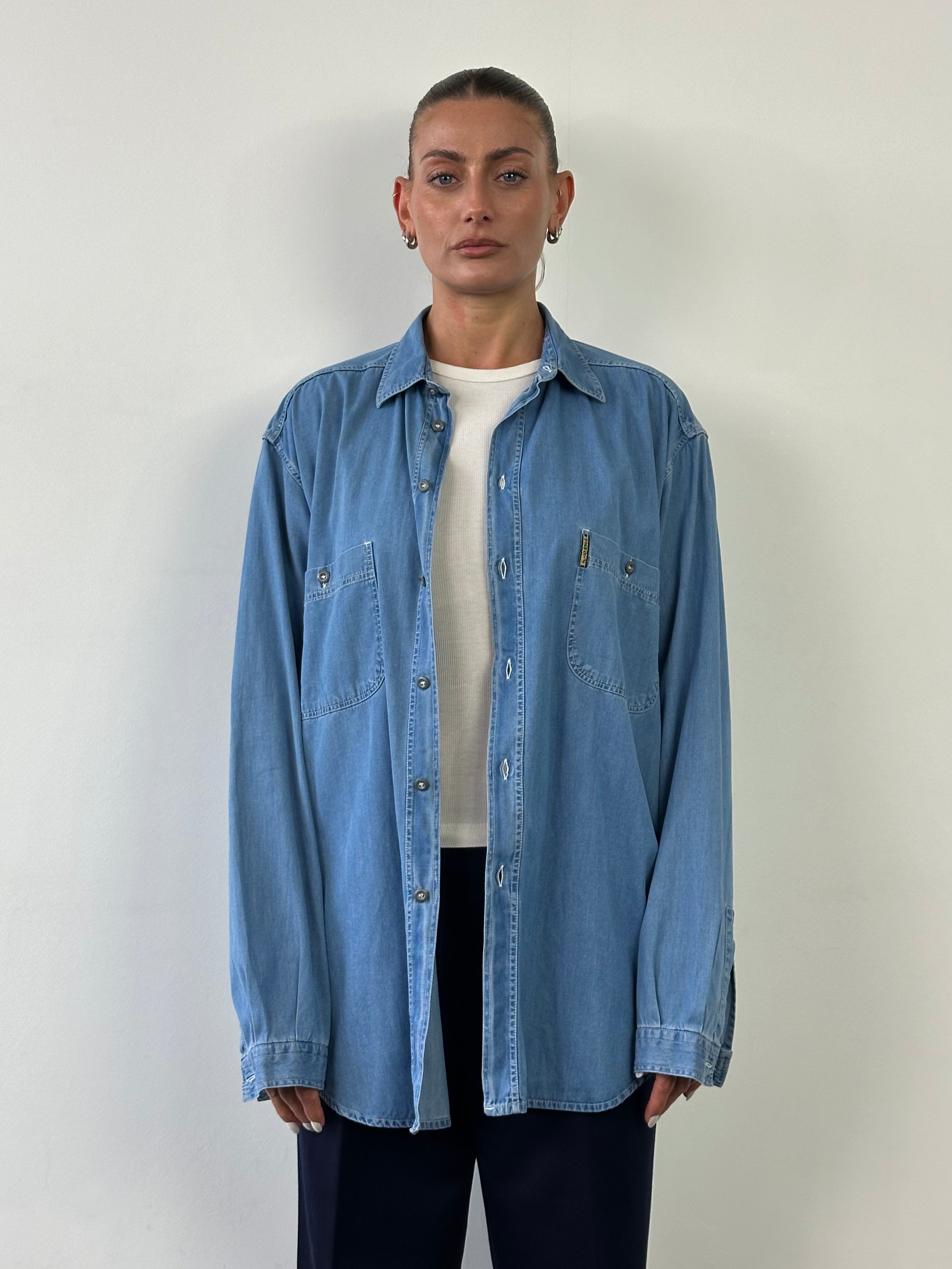 Armani Jeans denim logo shirt in size XL, featuring classic denim fabric and a prominent Armani logo on the front.