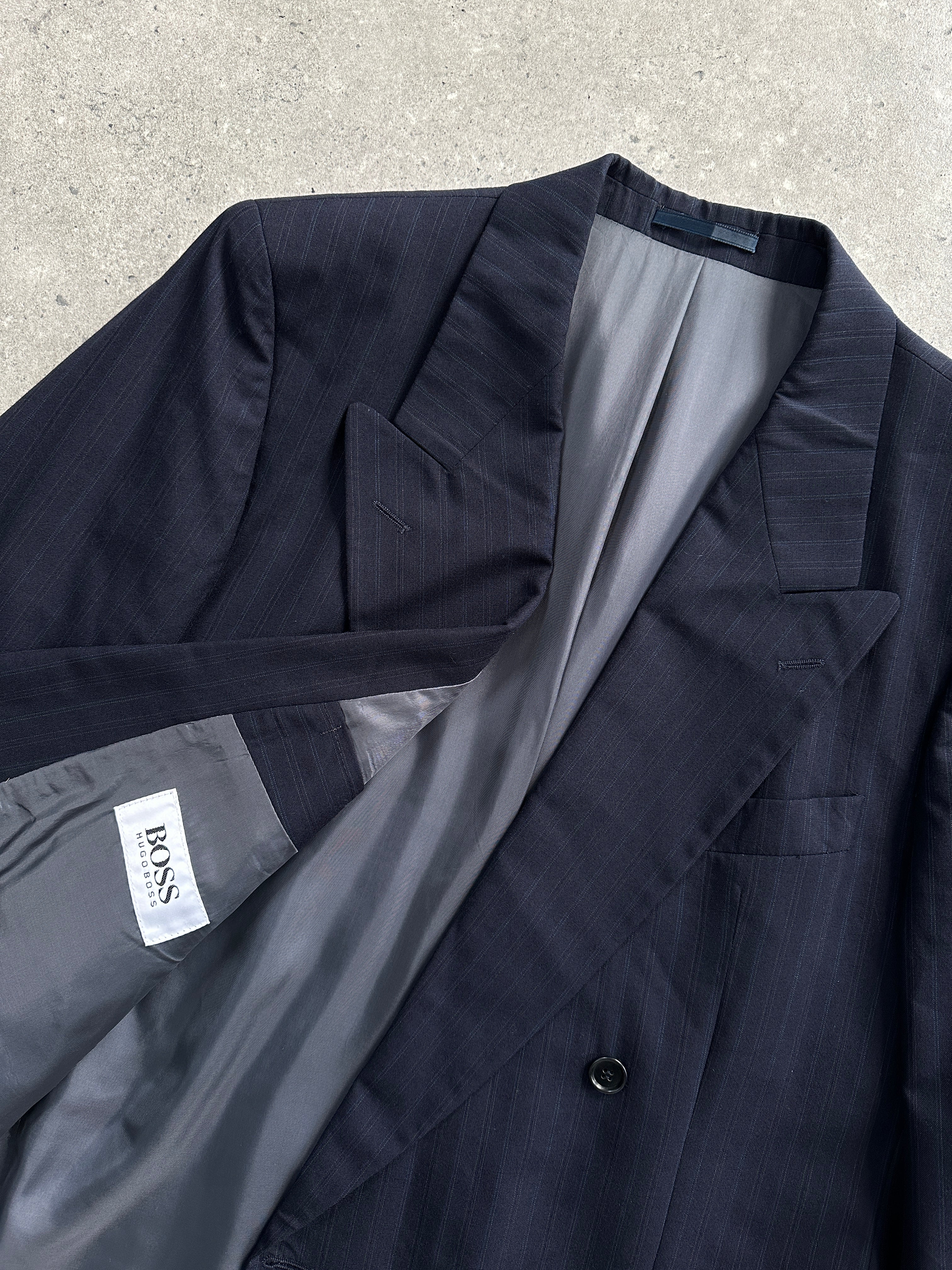 Hugo Boss pinstripe double-breasted wool blazer in size L, tailored fit with classic lapels and button details, front view.