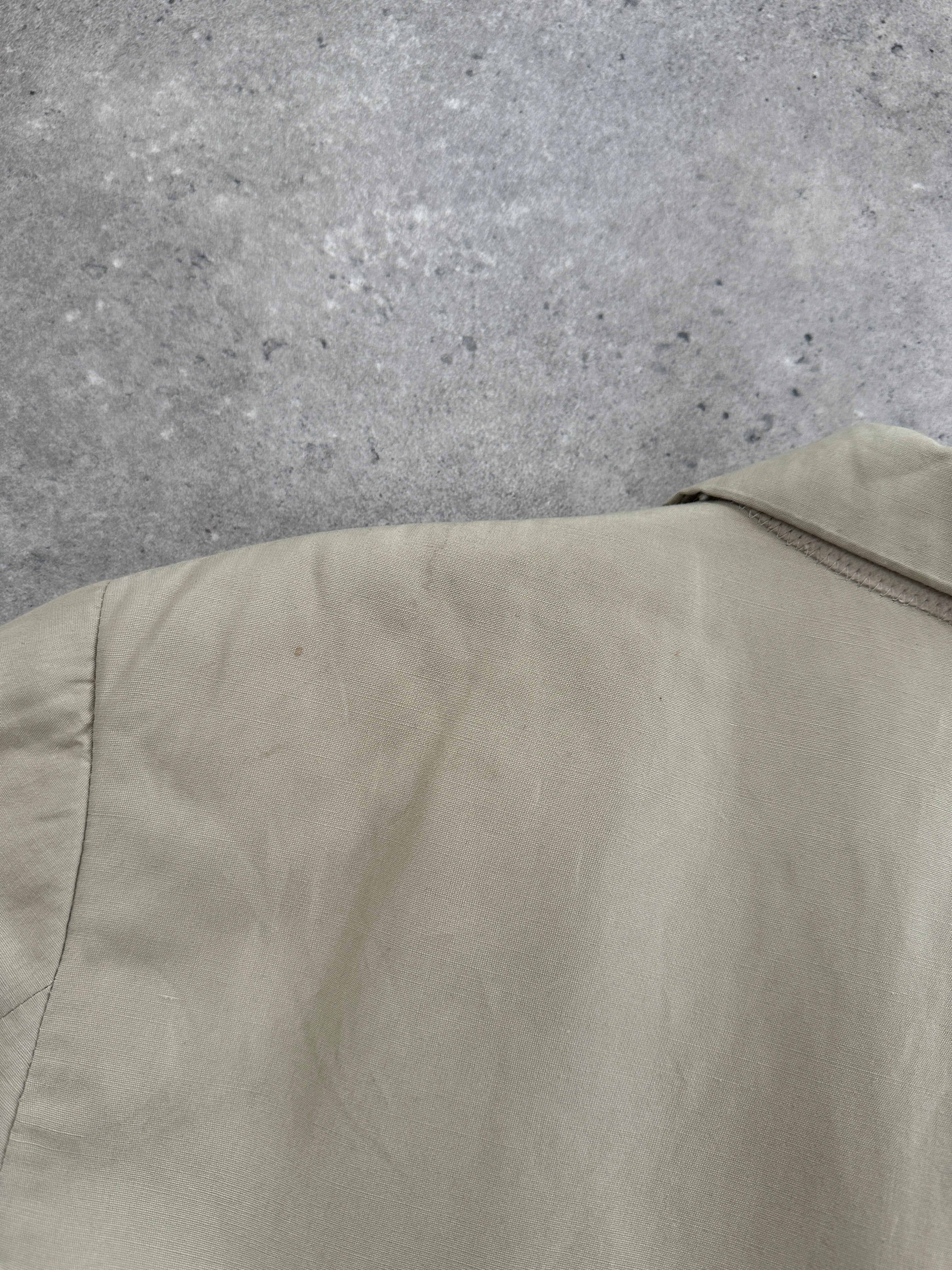 Emporio Armani linen single-breasted blazer in size 40R/L, tailored fit, beige color, featuring classic lapel and button closure.