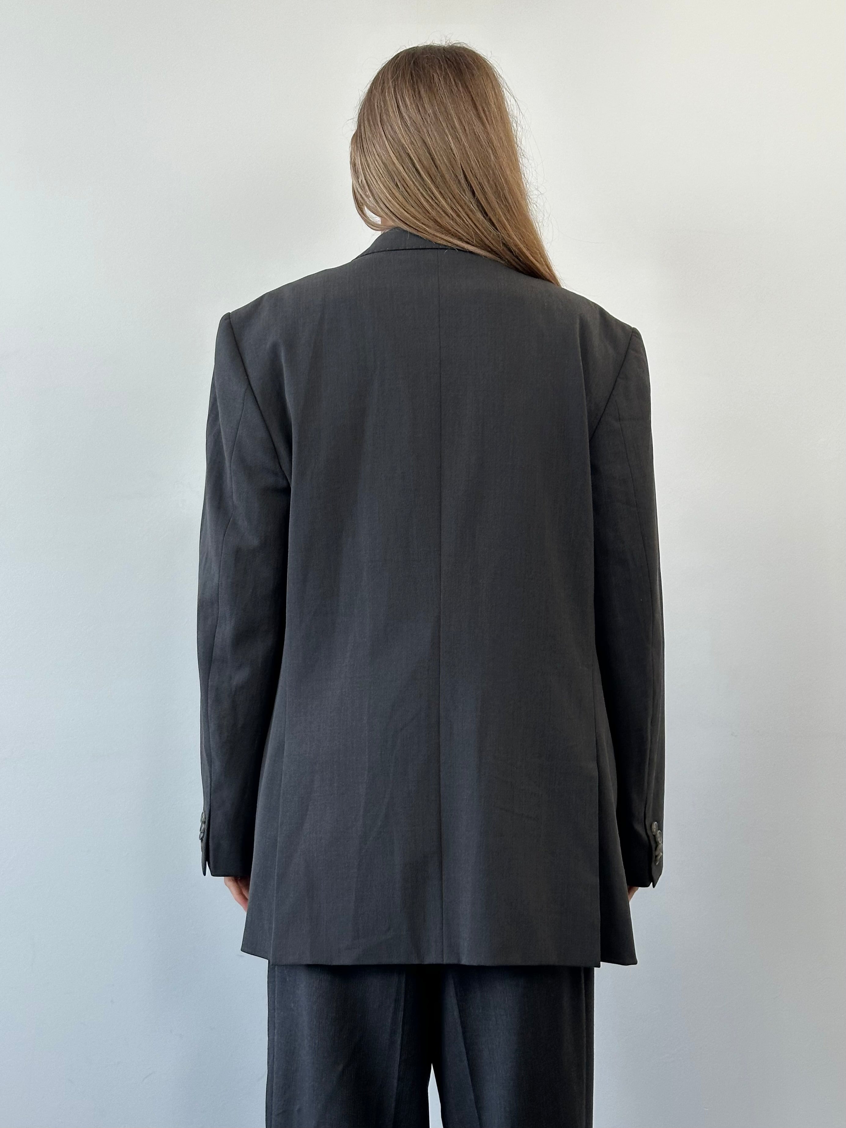 Versace Collection 2000s wool single-breasted blazer in size 42R/XL, dark tailored design, with lapel collar and button closure.