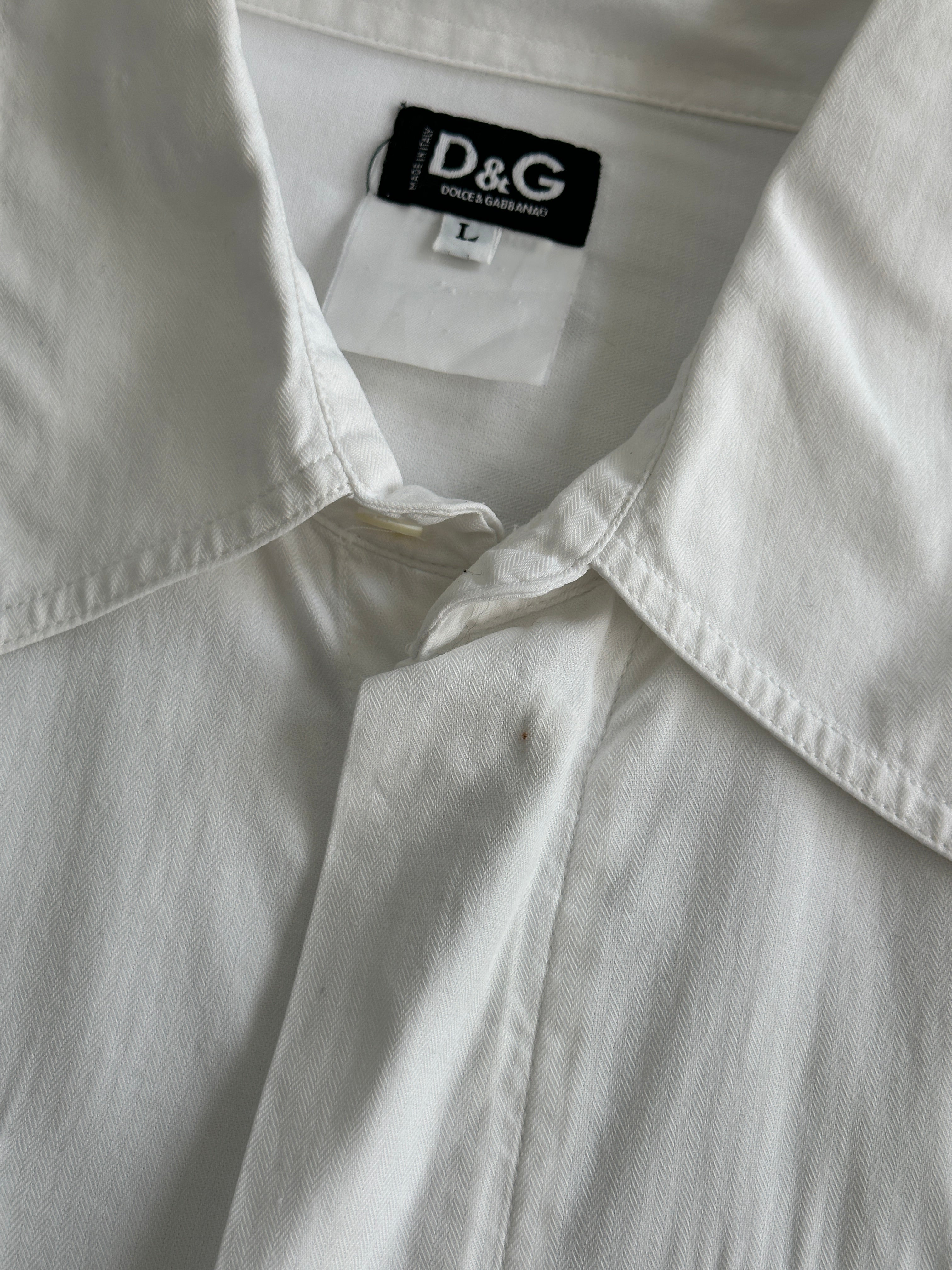Dolce & Gabbana cotton shirt in size M/L, featuring classic design and button-down front, displayed on a hanger.