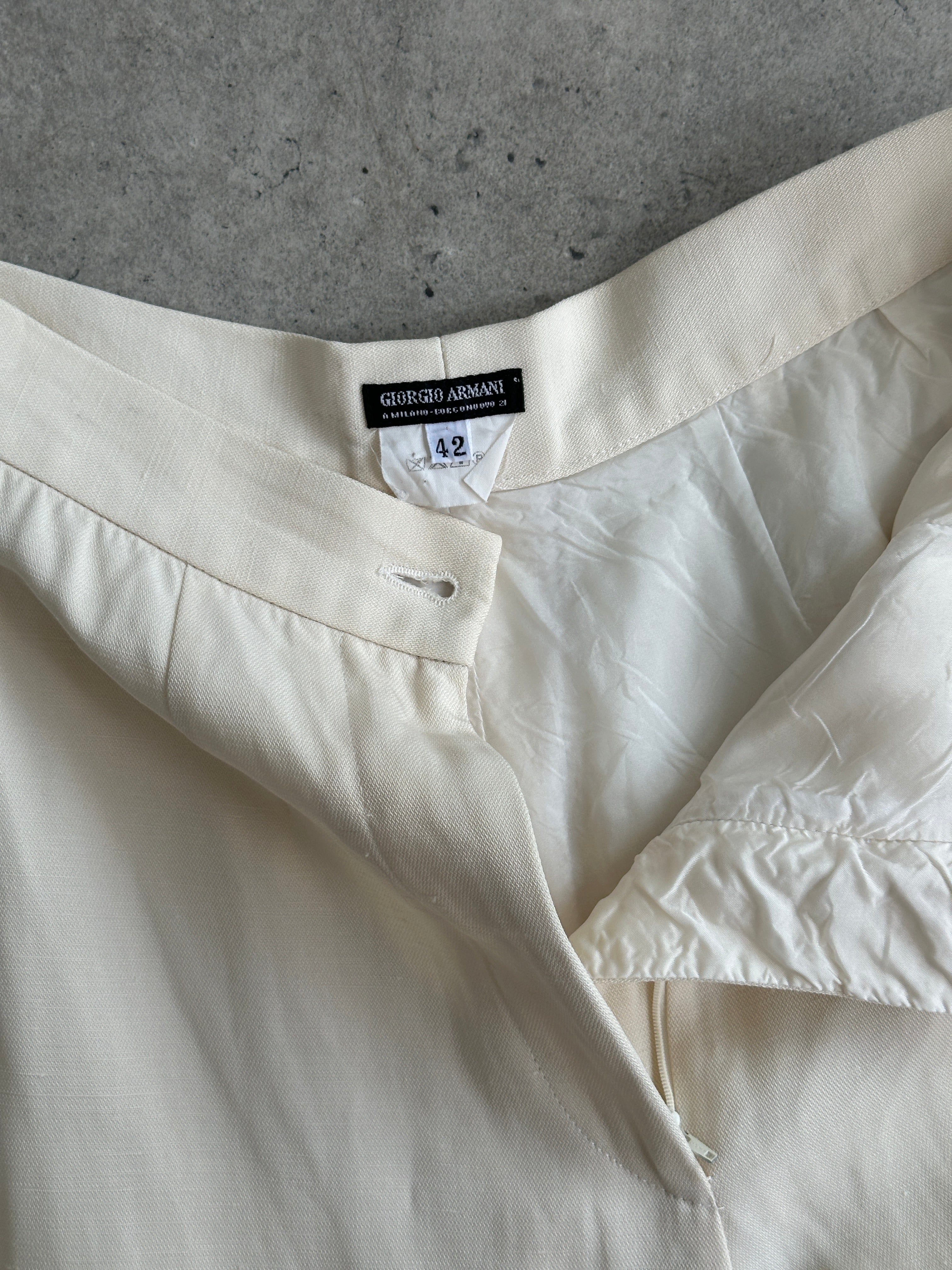 Giorgio Armani 1990s wide-leg tailored trousers in beige, featuring a high waist and classic fit, size W28.