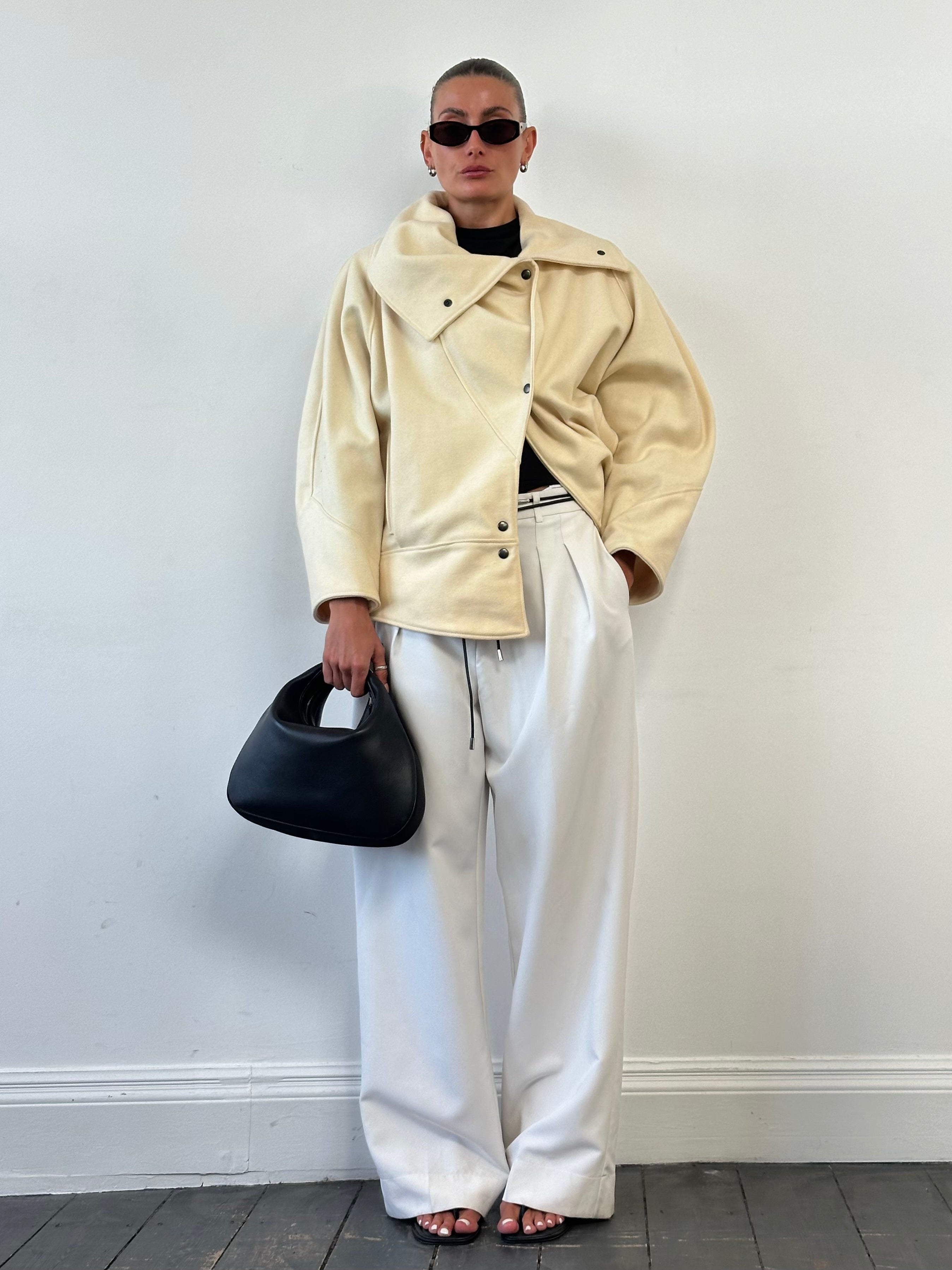 Vintage asymmetric wool bomber jacket with funnel neck, in classic style, featuring a unique design and tailored fit.