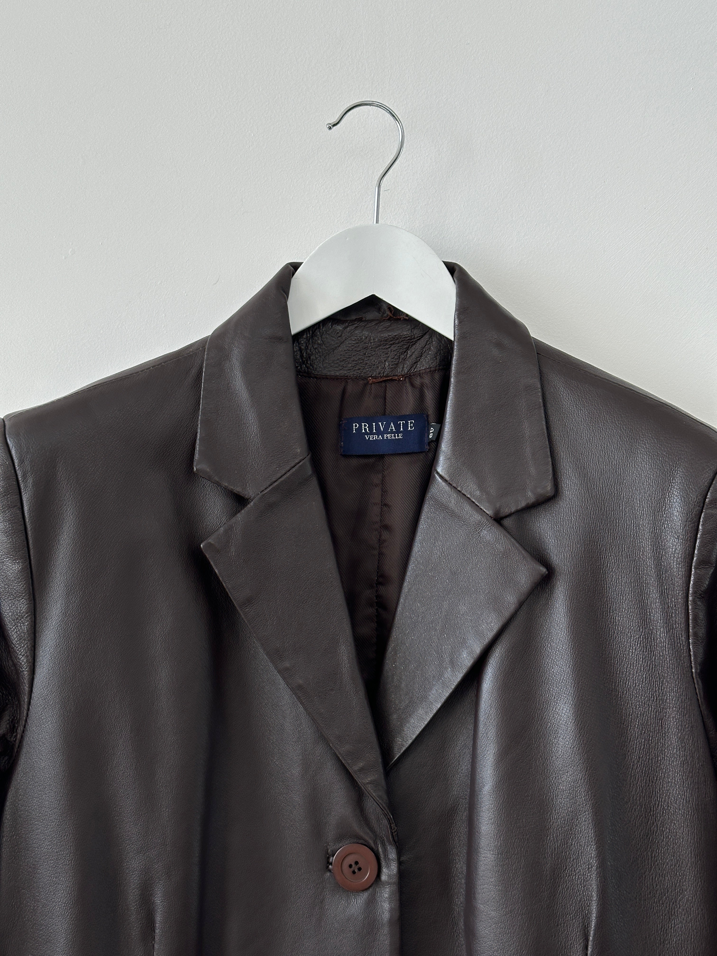 Vintage minimal leather trench coat jacket in size L, featuring sleek design and classic silhouette.