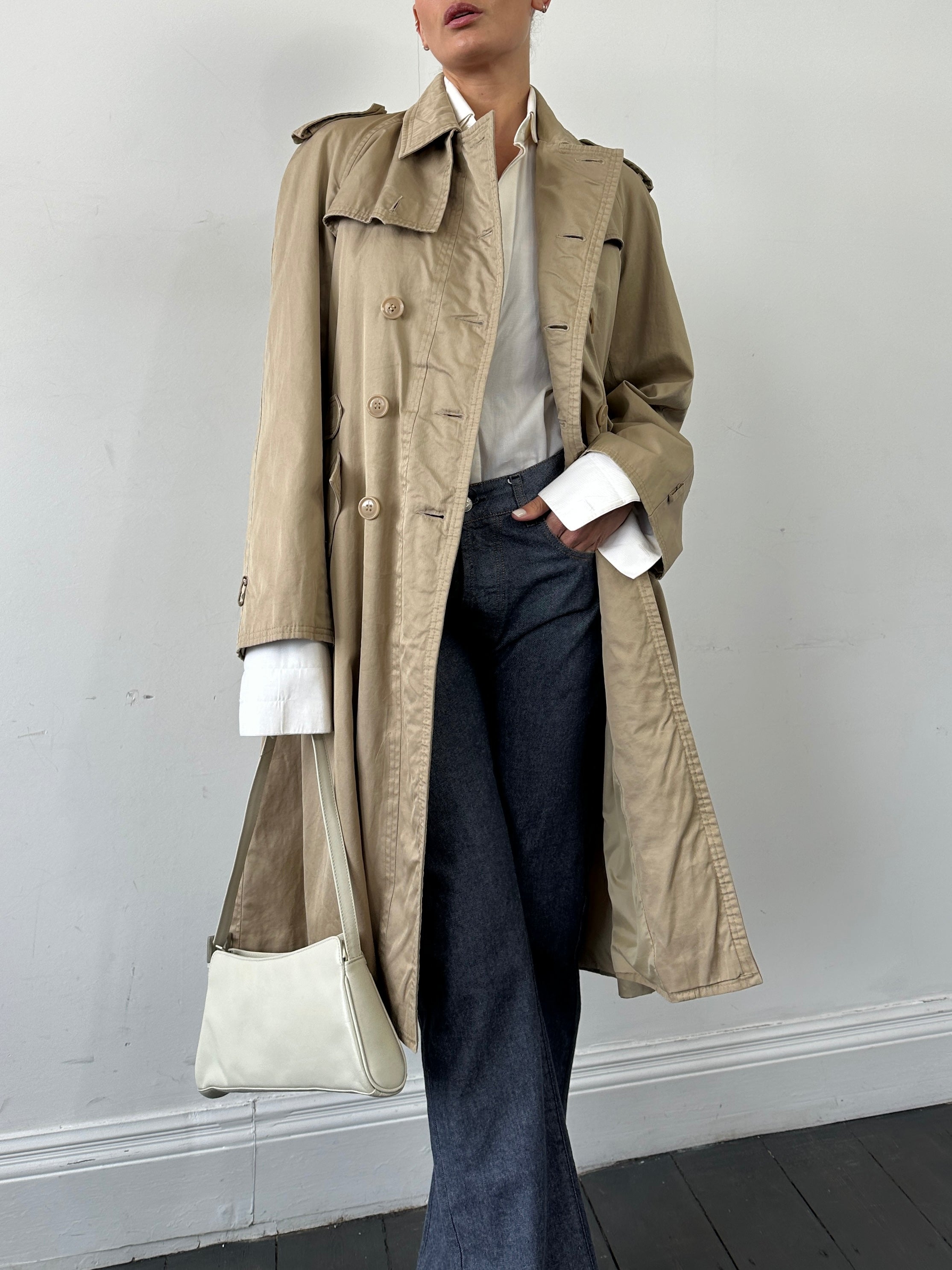 Yves Saint Laurent pure cotton double-breasted trench coat in size M, beige color, featuring classic lapels and button details.