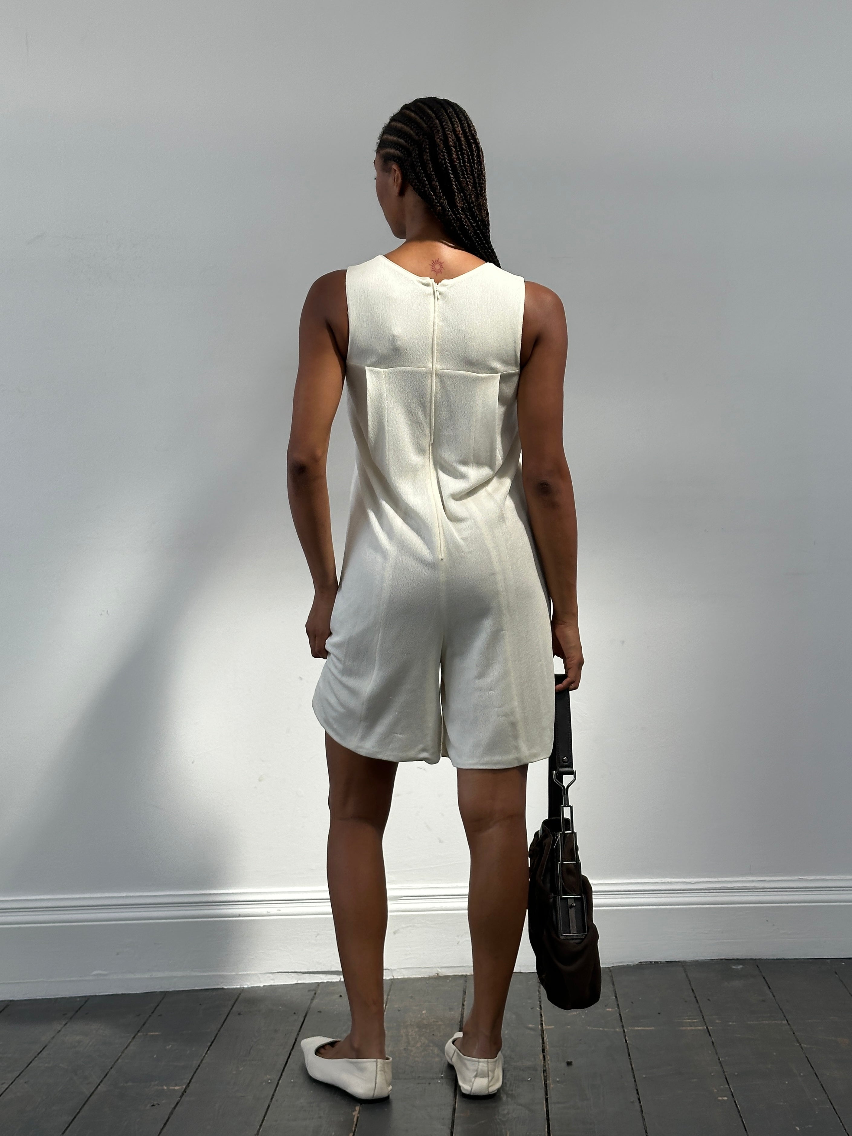 Giorgio Armani 2015 double-layered playsuit in size S, featuring sleek fabric and modern design, worn by a model.
