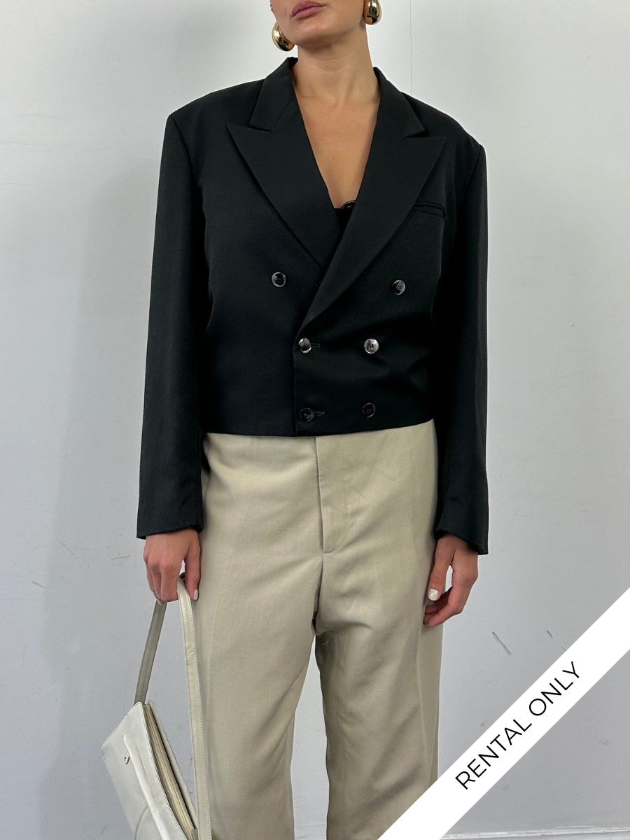 Vintage 1980s cropped double-breasted blazer in size M, featuring classic tailored design and structured lapels.