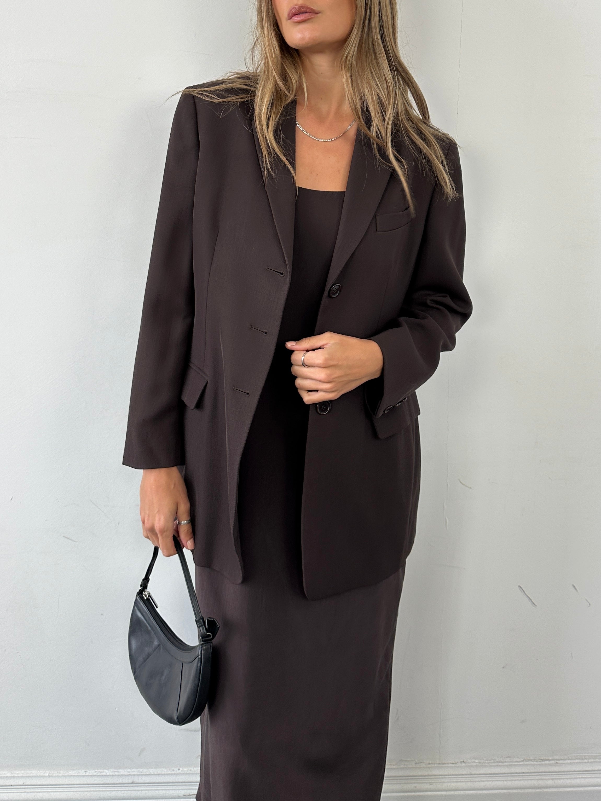 Max Mara virgin wool single-breasted blazer, size M, tailored fit with notch lapel and structured design, shown on a hanger.