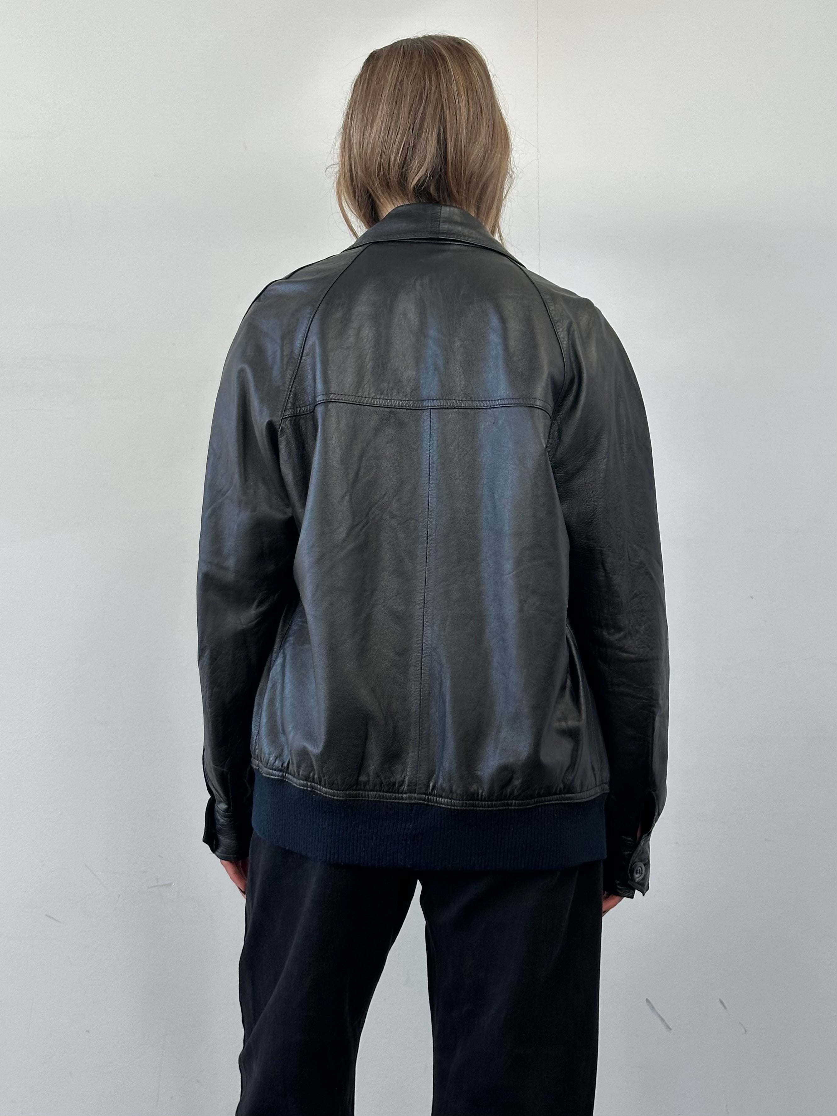 Vintage Dagger Collar Leather Bomber Jacket, size Large, with rugged leather texture and classic bomber style.
