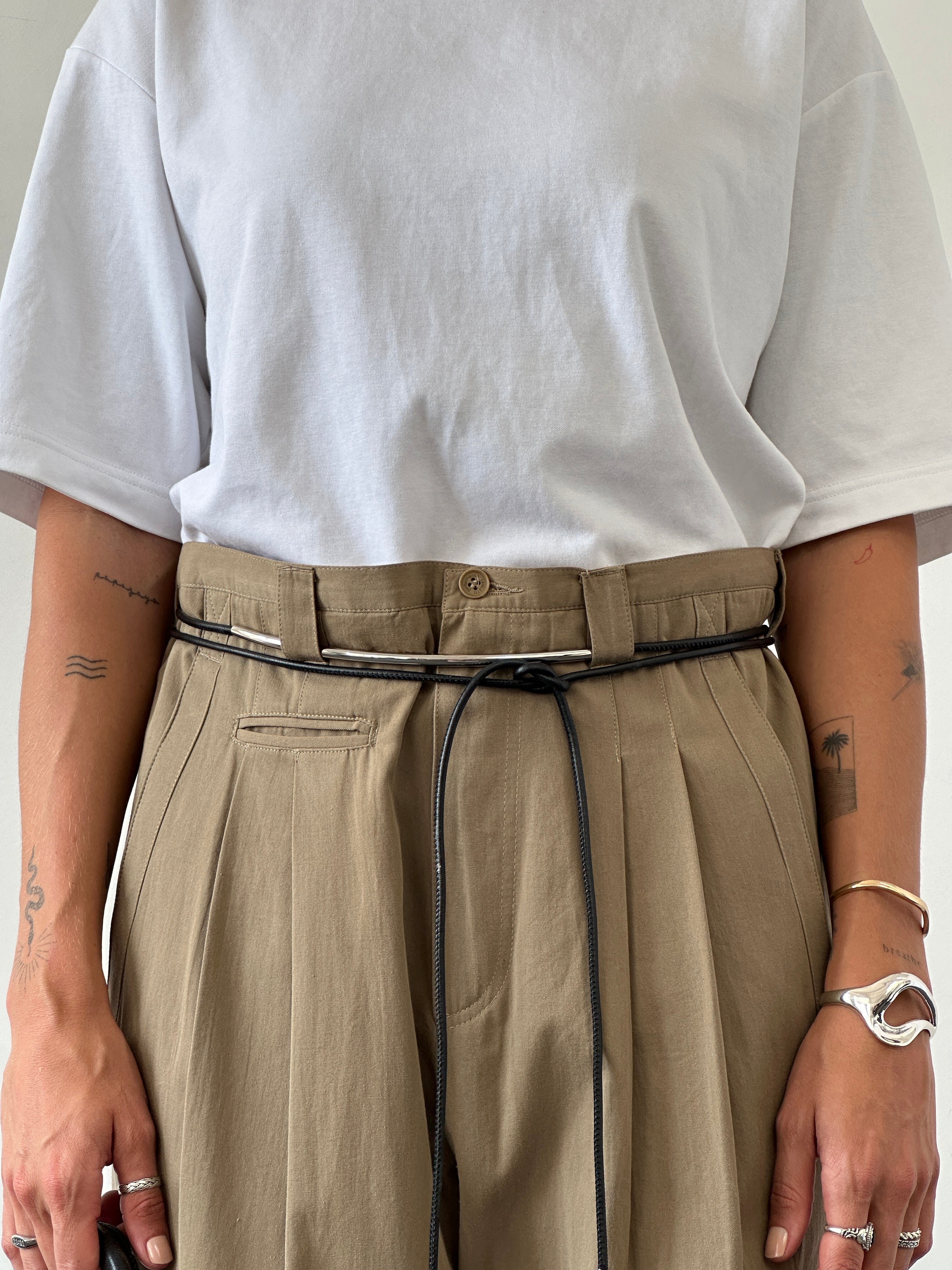 Vintage pure cotton straight-leg pleated trousers in beige, shown flat with waistband and front pleats, size W35.