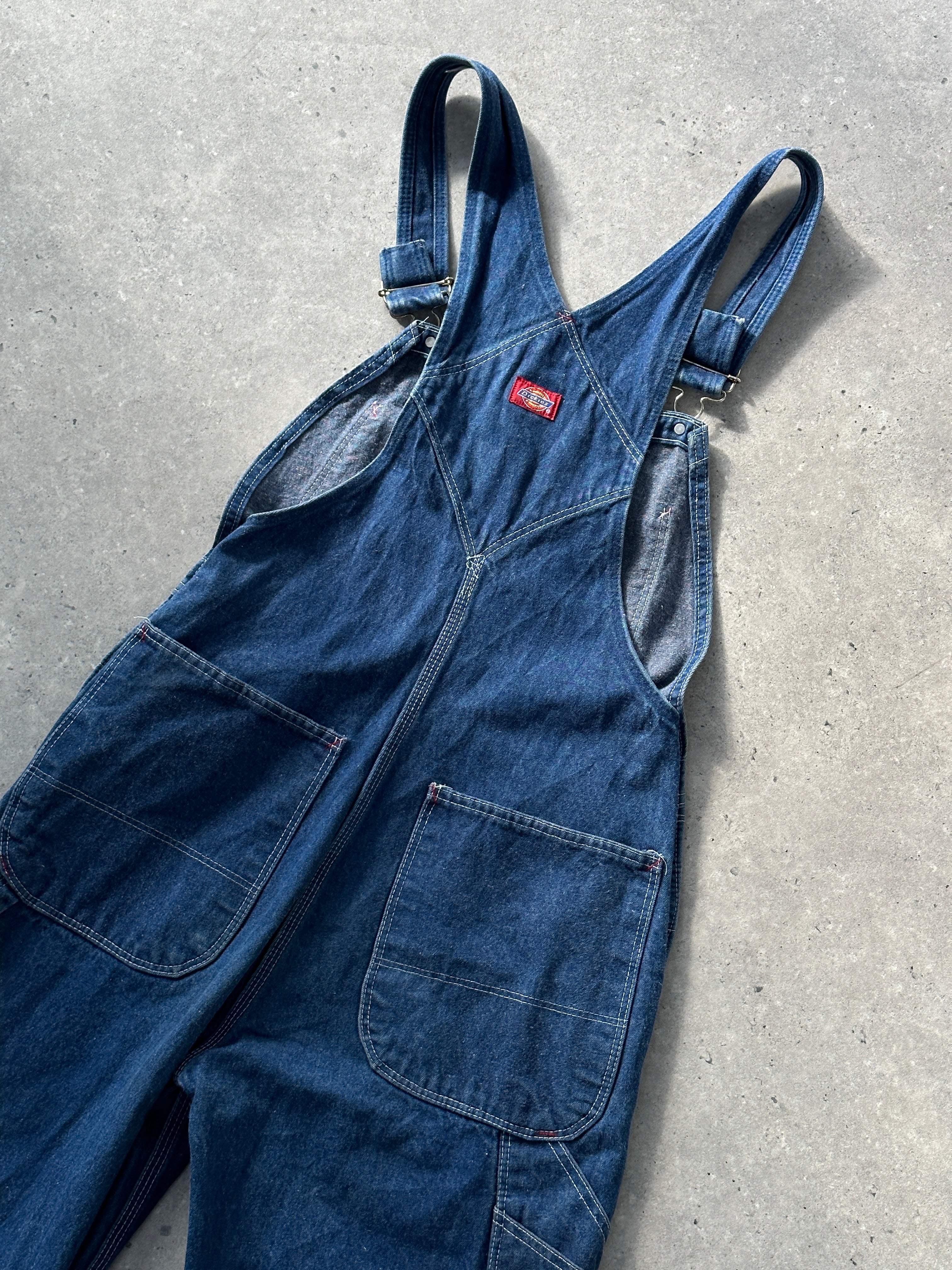 Dickies pure cotton denim dungarees in size XS/S, showing front view with adjustable shoulder straps and classic stitching.