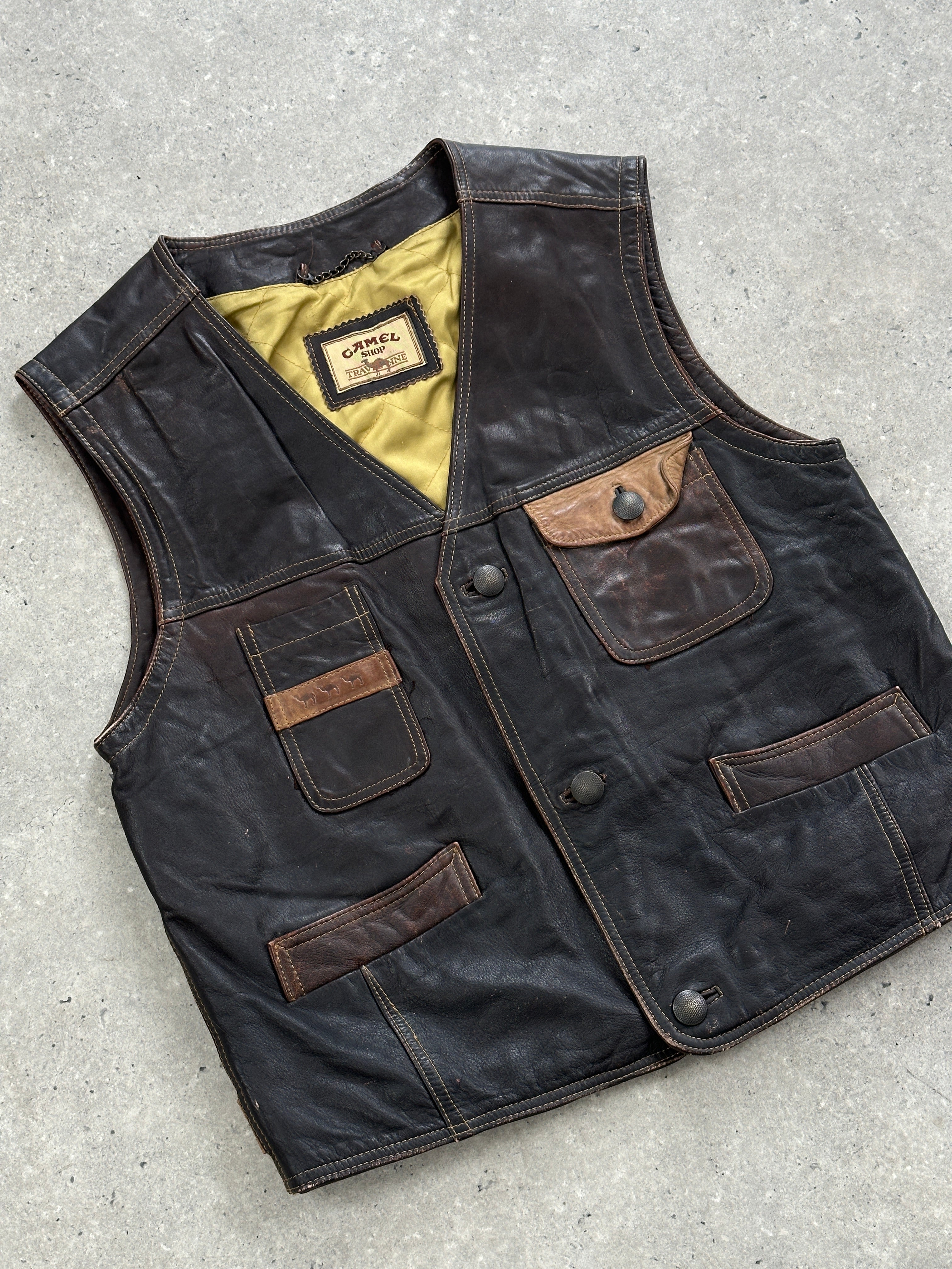 Vintage camel distressed leather waistcoat, size M, featuring rugged texture and classic design for a stylish, vintage look.
