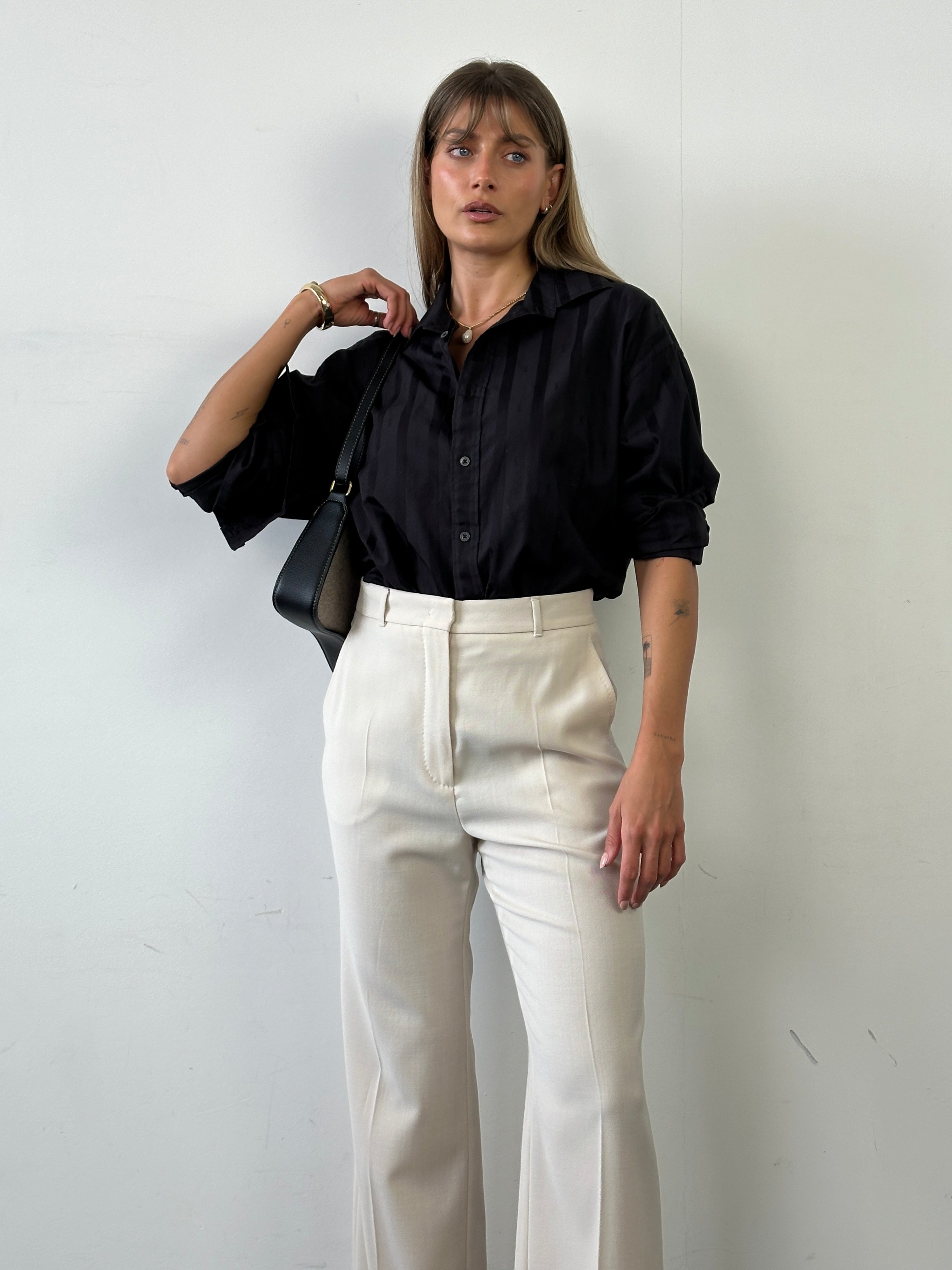 Max Mara pure wool high-waisted tailored trousers in classic design, displayed on a neutral background.