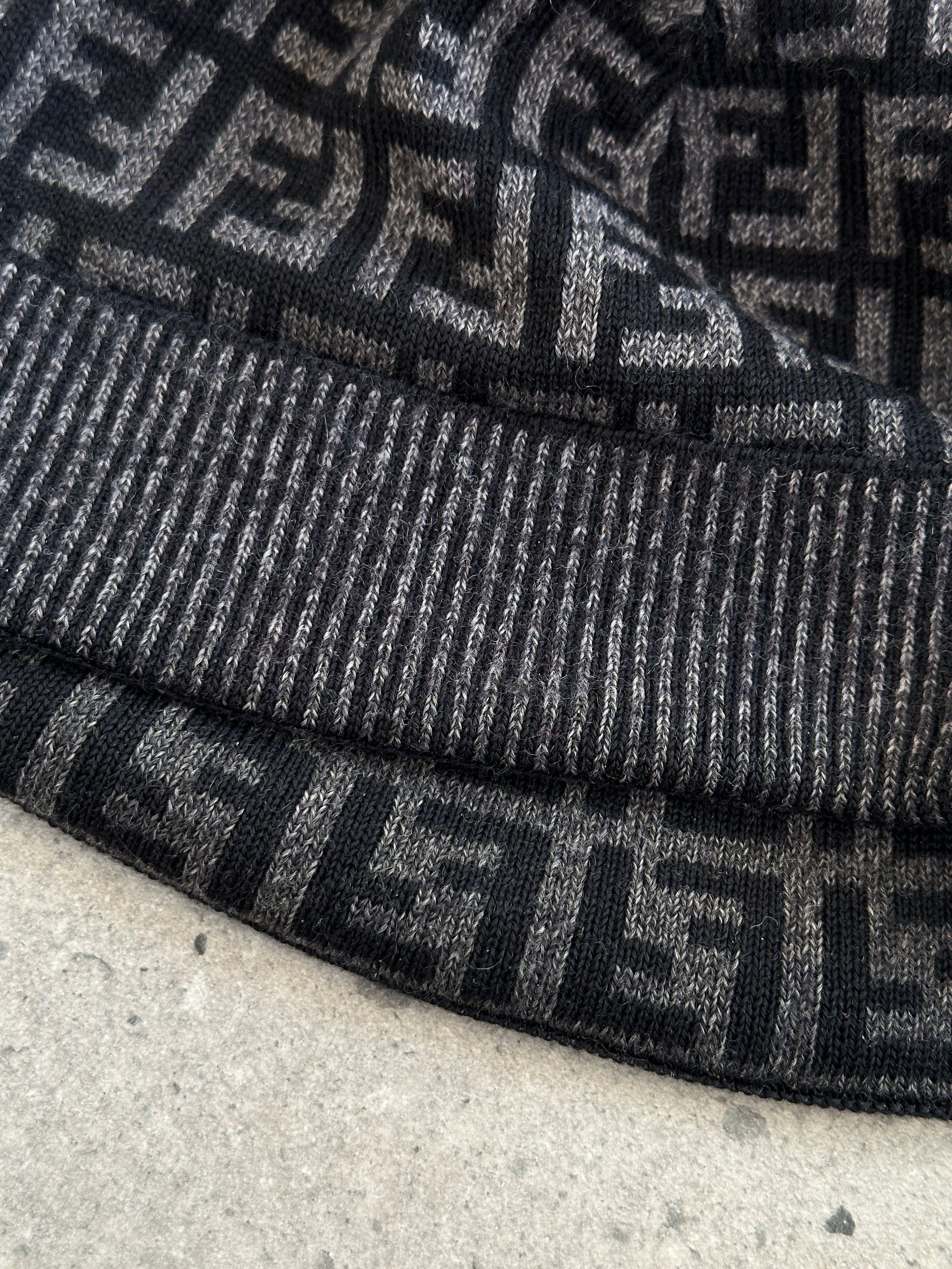Fendi FF monogram print beanie hat in black with knit texture, featuring the iconic logo pattern and a snug fit.