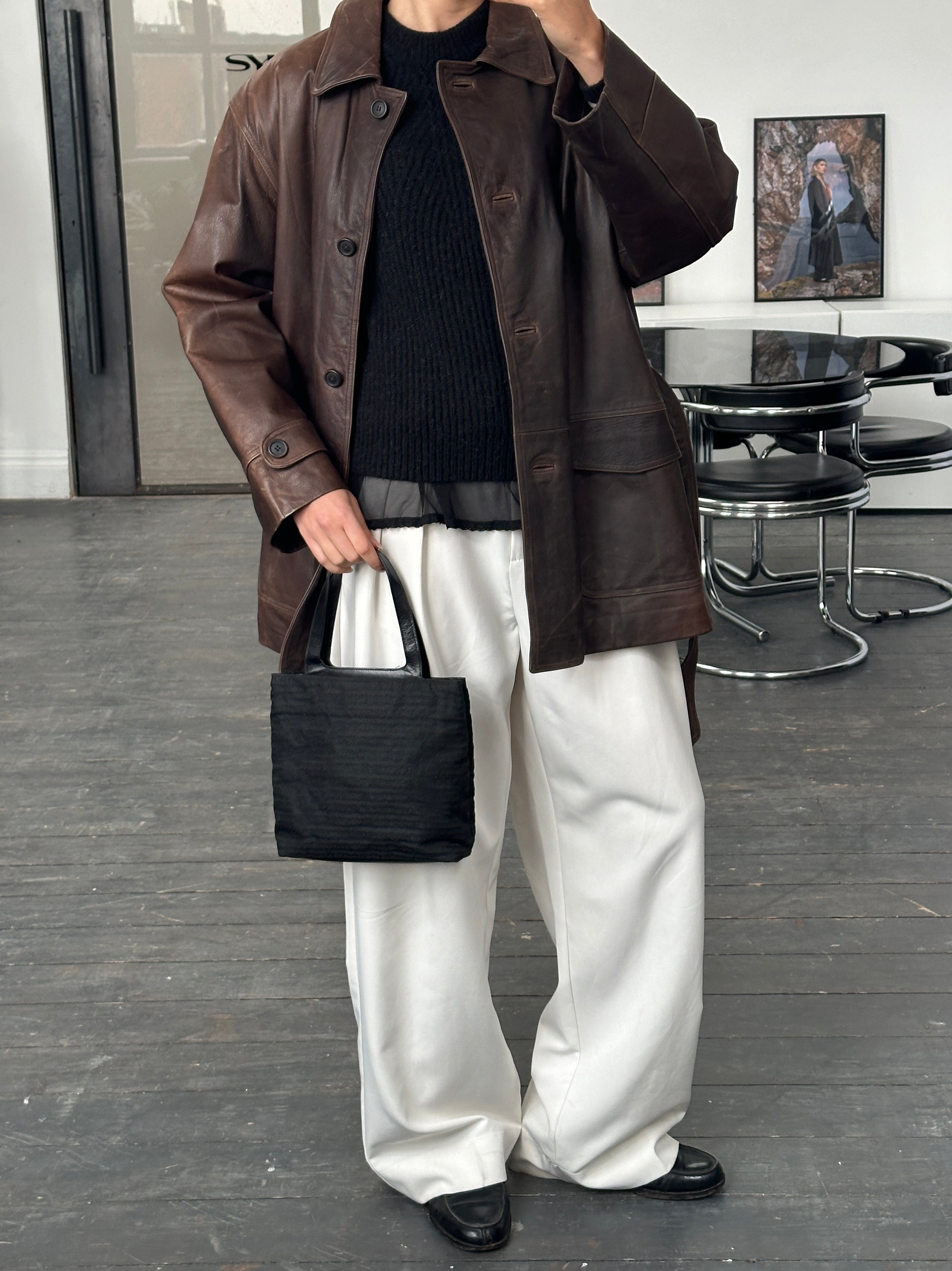 Vintage Italian 1990s belted leather jacket in XL, showing aged brown leather with classic detailing and a front belt.