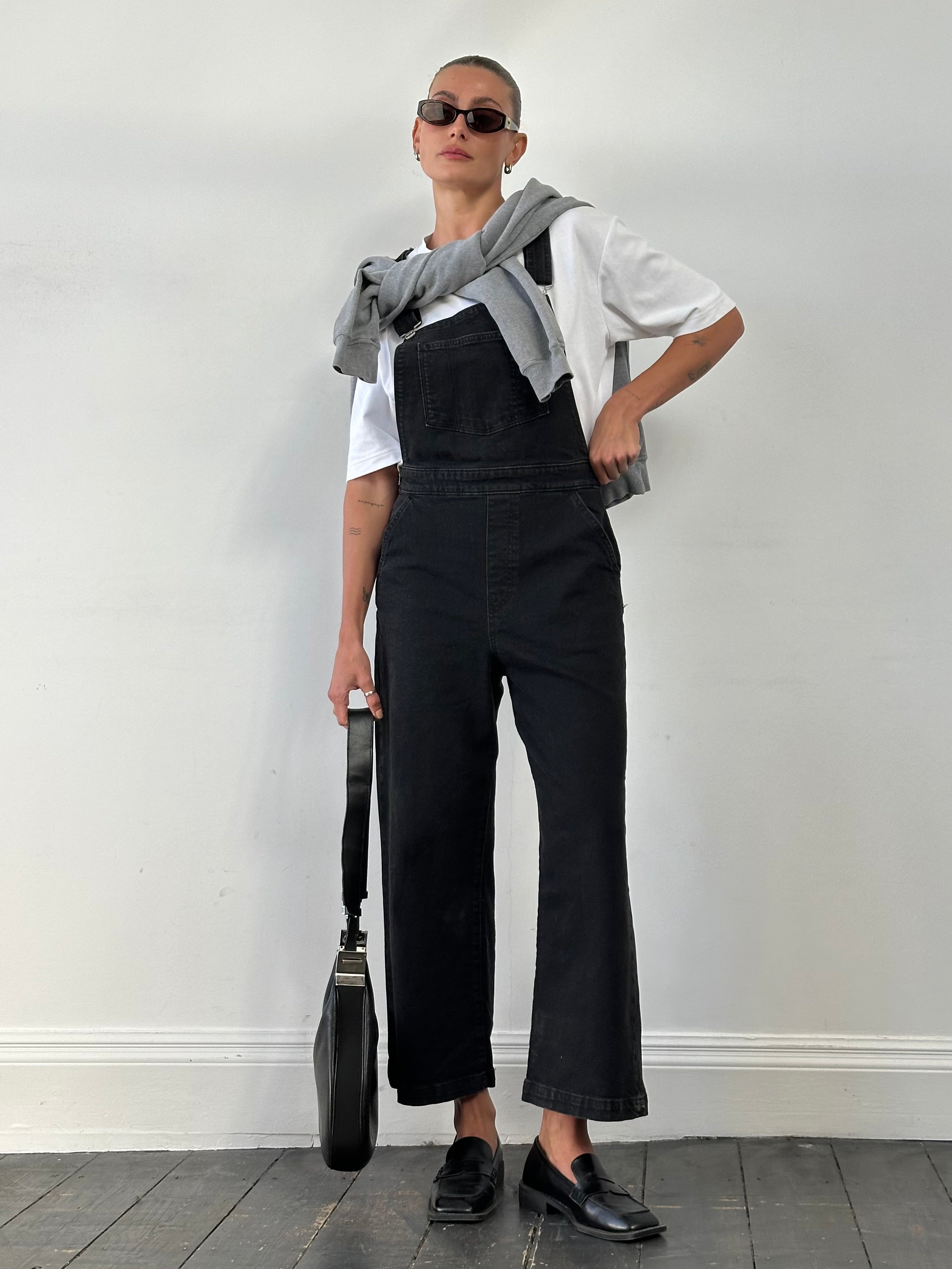 Levi’s Premium Denim Dungarees in size M, showing classic blue denim with adjustable shoulder straps and front pockets.