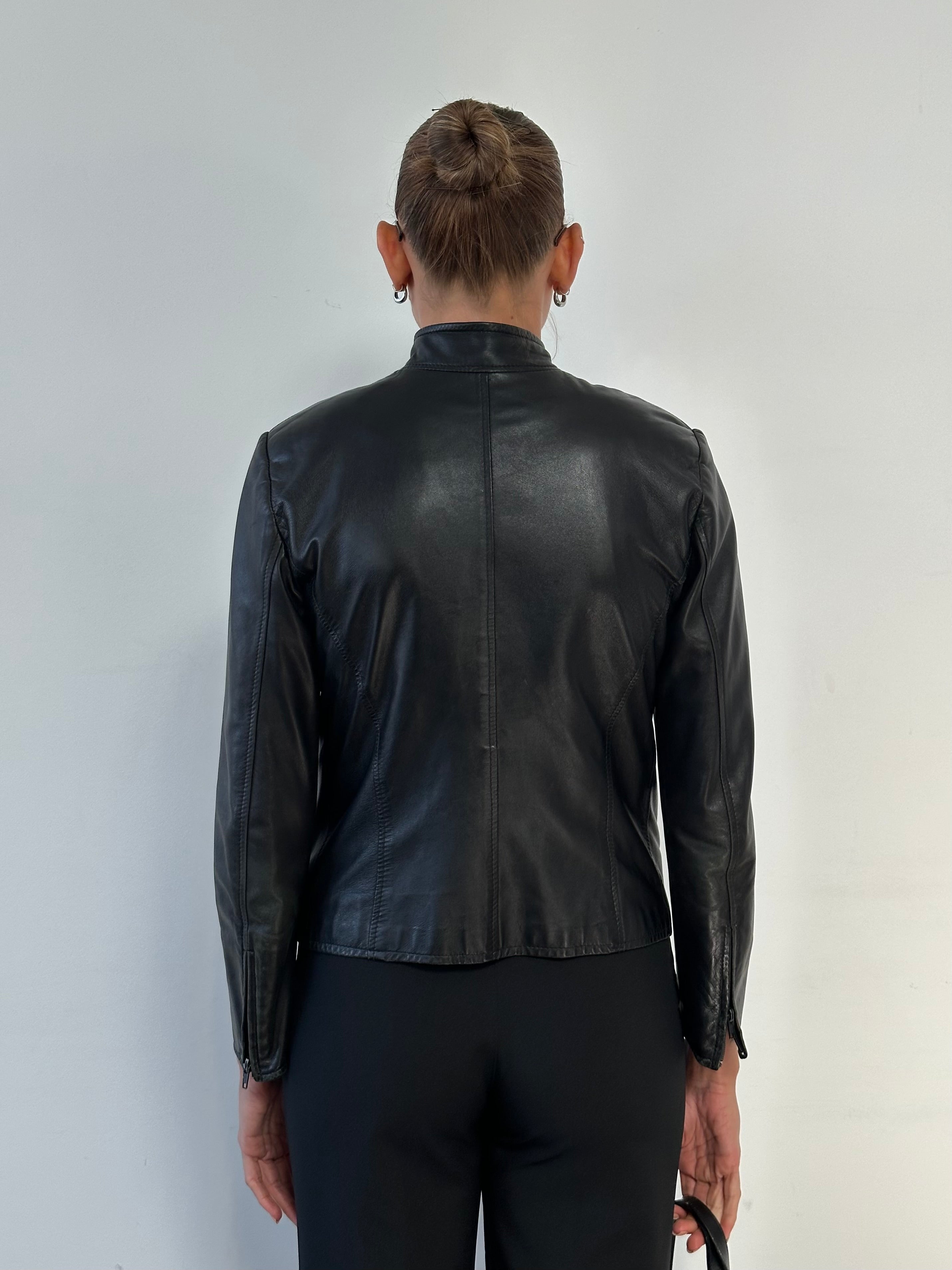 Vintage Moto fitted leather jacket in XS, showcasing classic design with a sleek black finish and detailed stitching.