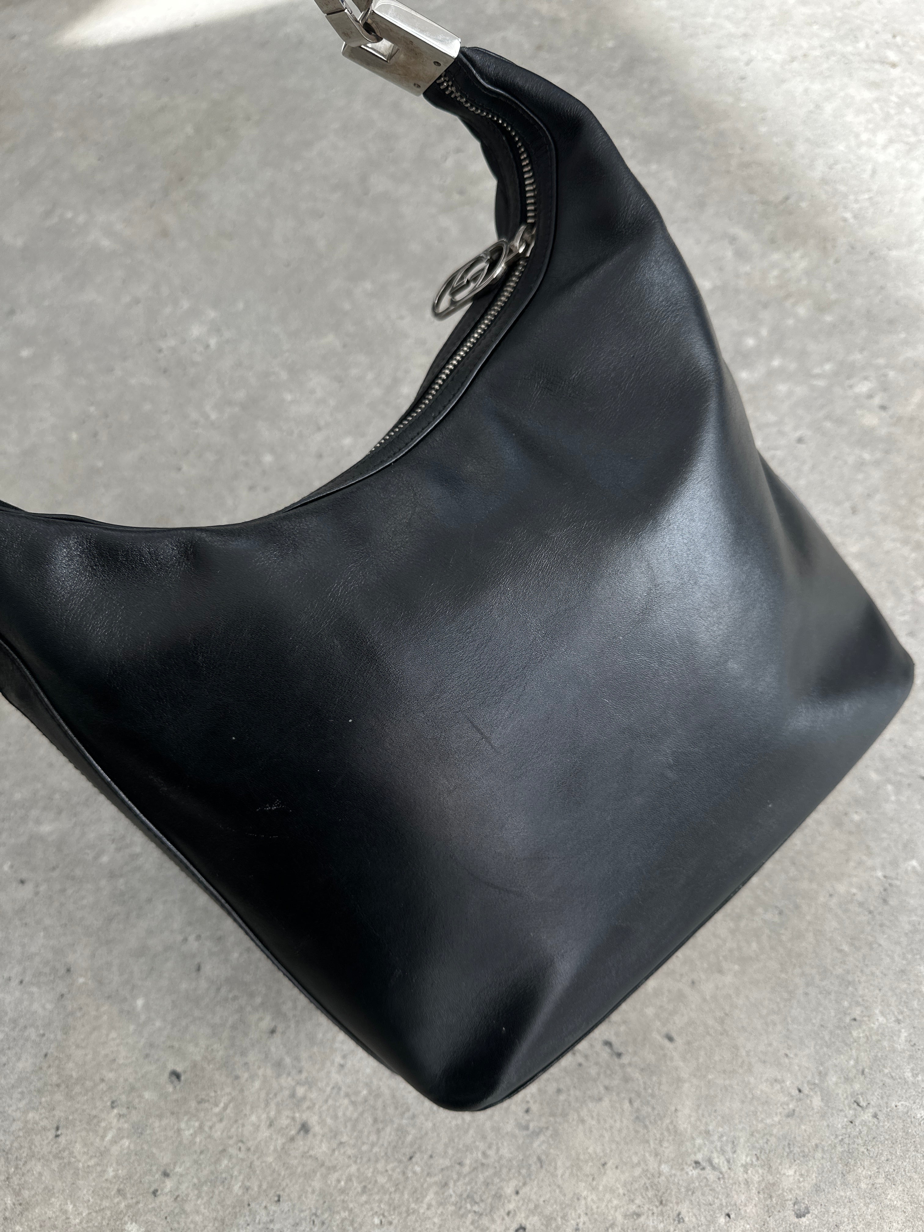Gucci 1990s Tom Ford GG leather hobo shoulder bag with gold-tone hardware and slouchy design.