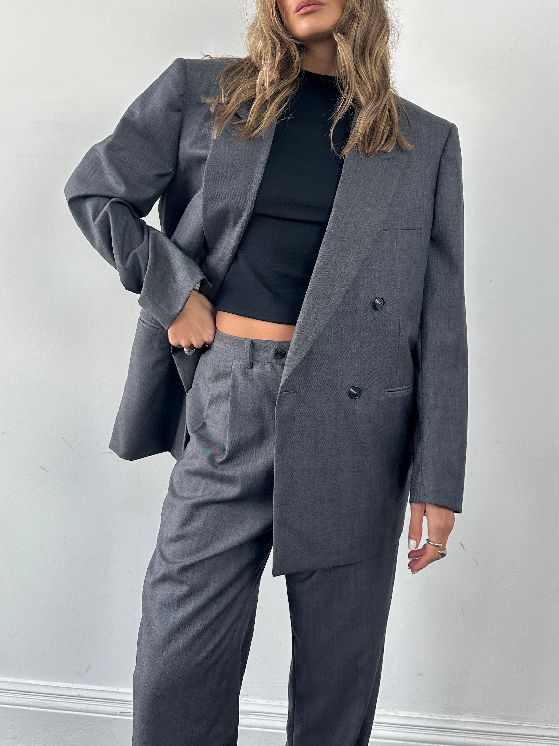 Christian Dior wool double-breasted jumpsuit in size 44S/W34, tailored with a sophisticated fit and classic design.