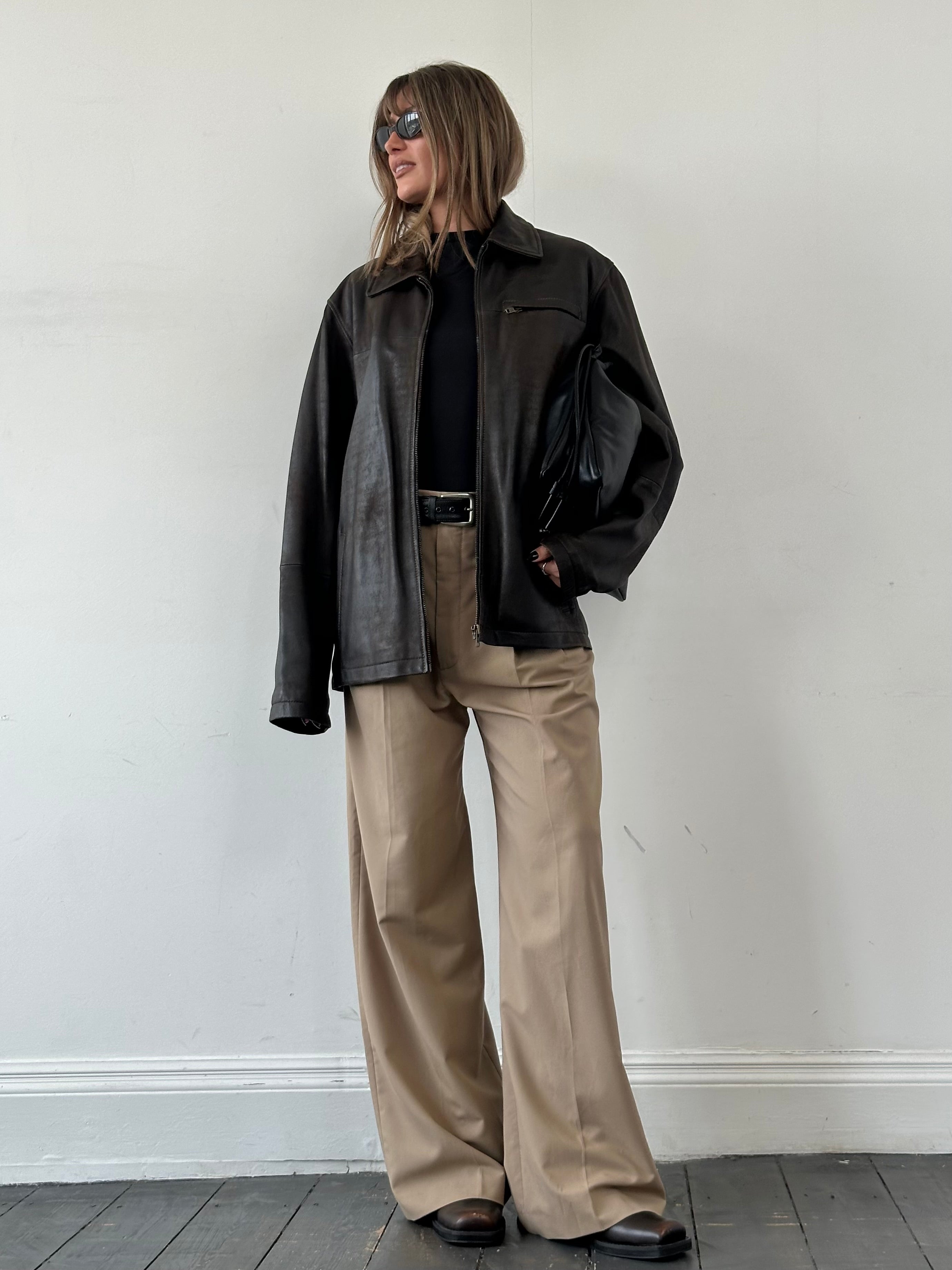 Vintage aged leather jacket in size XL, showing distressed brown leather with classic design and vintage detailing.