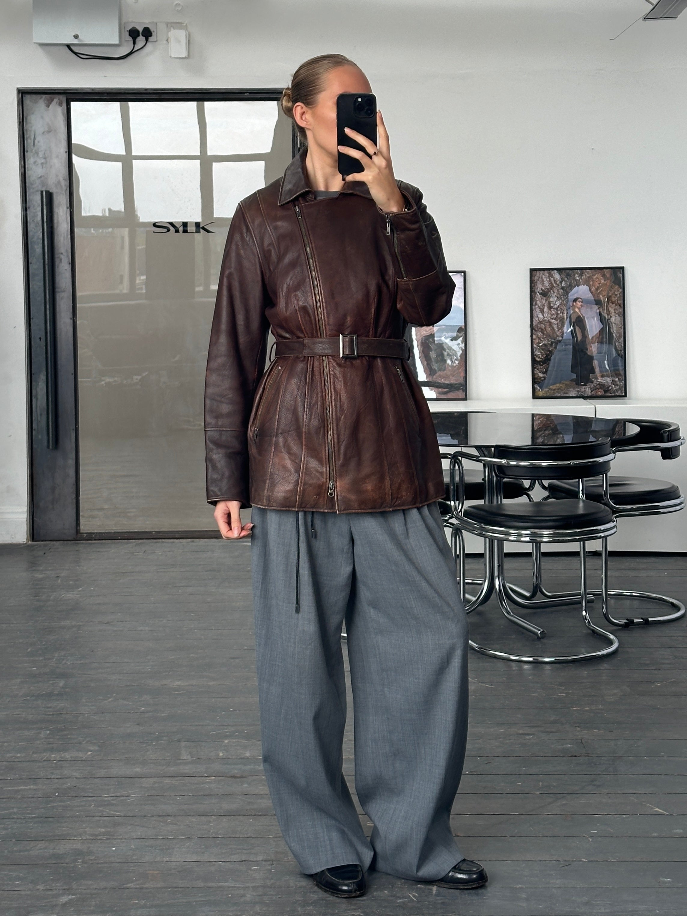 Vintage 1990s aged leather jacket with double zip and belt detail, size large, classic retro style by Vintage brand.