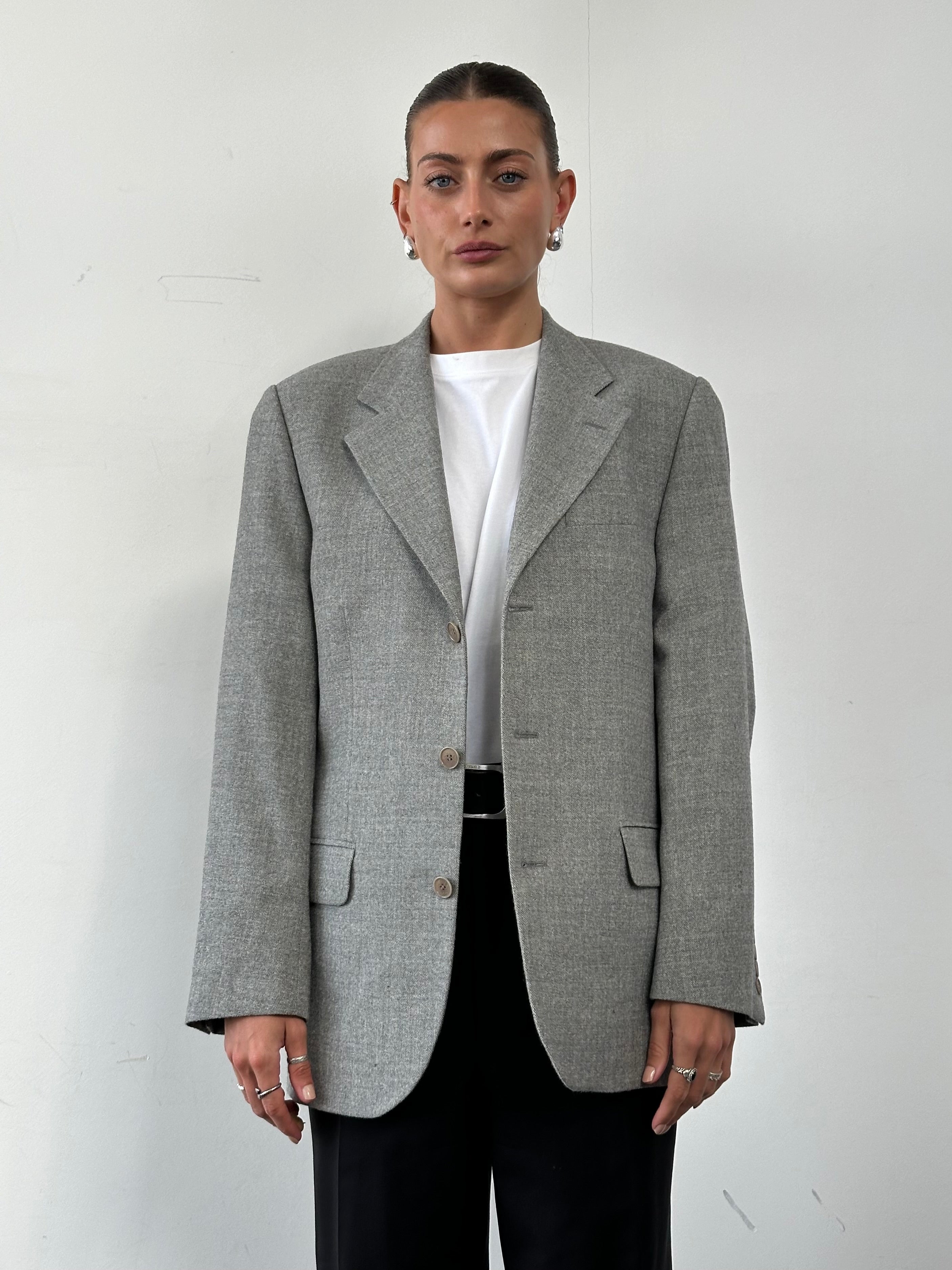 Vintage branded brushed wool single-breasted blazer in size M featuring a classic tailored fit and textured fabric.