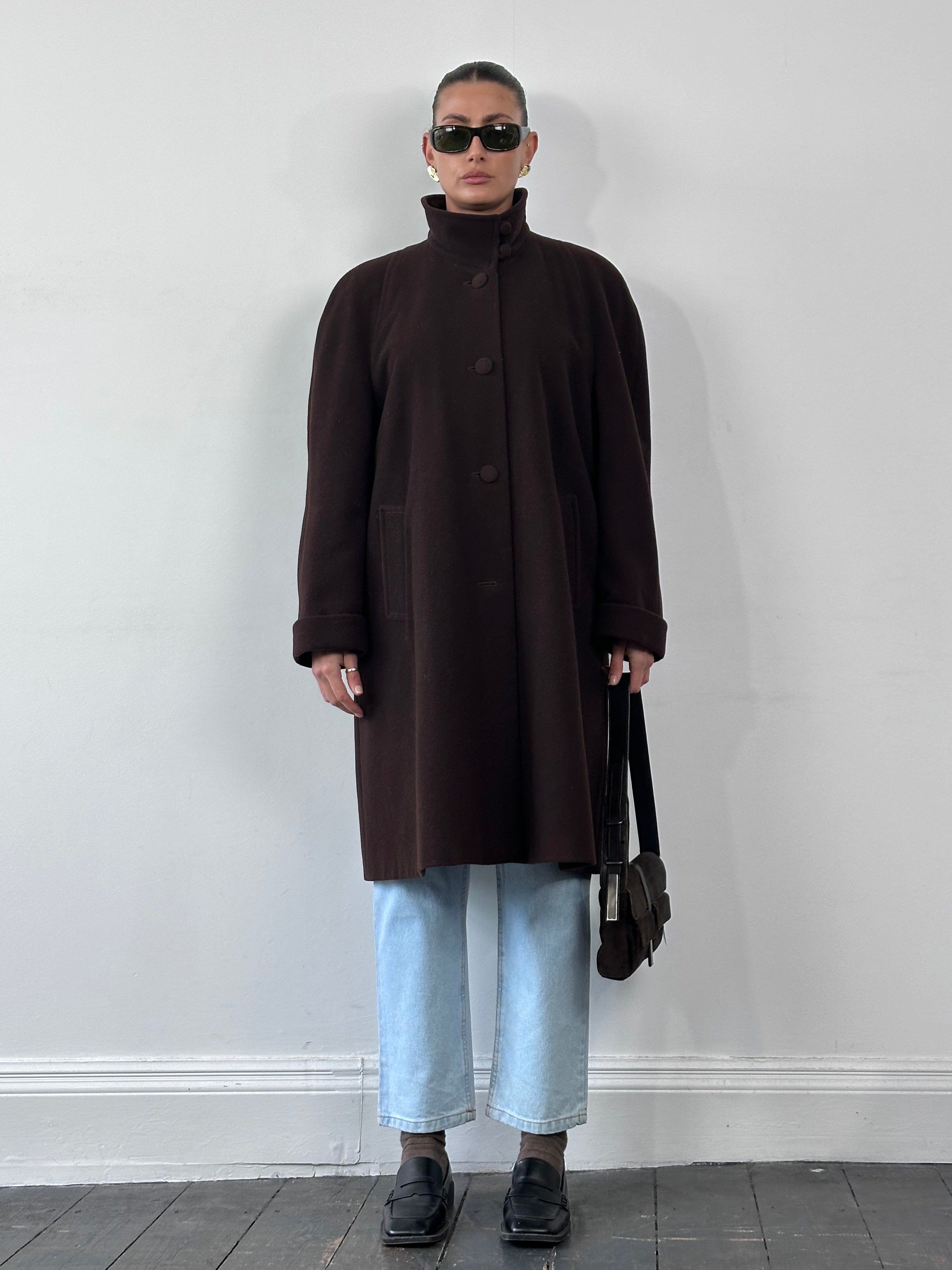 Vintage wool A-line funnel neck coat in size XL, featuring a classic design and cozy fabric, displayed on a hanger.