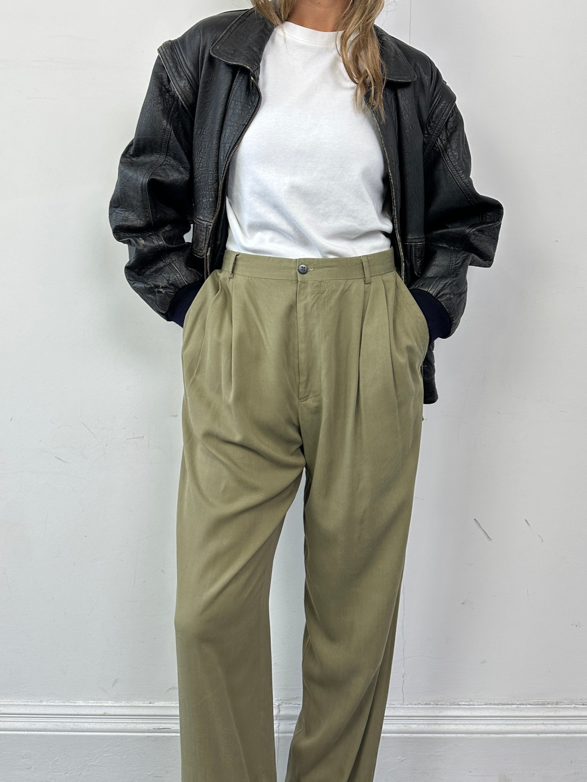 Versace Versus silk high-waisted straight leg trousers in vibrant color, tailored fit, with elegant waistband detail.