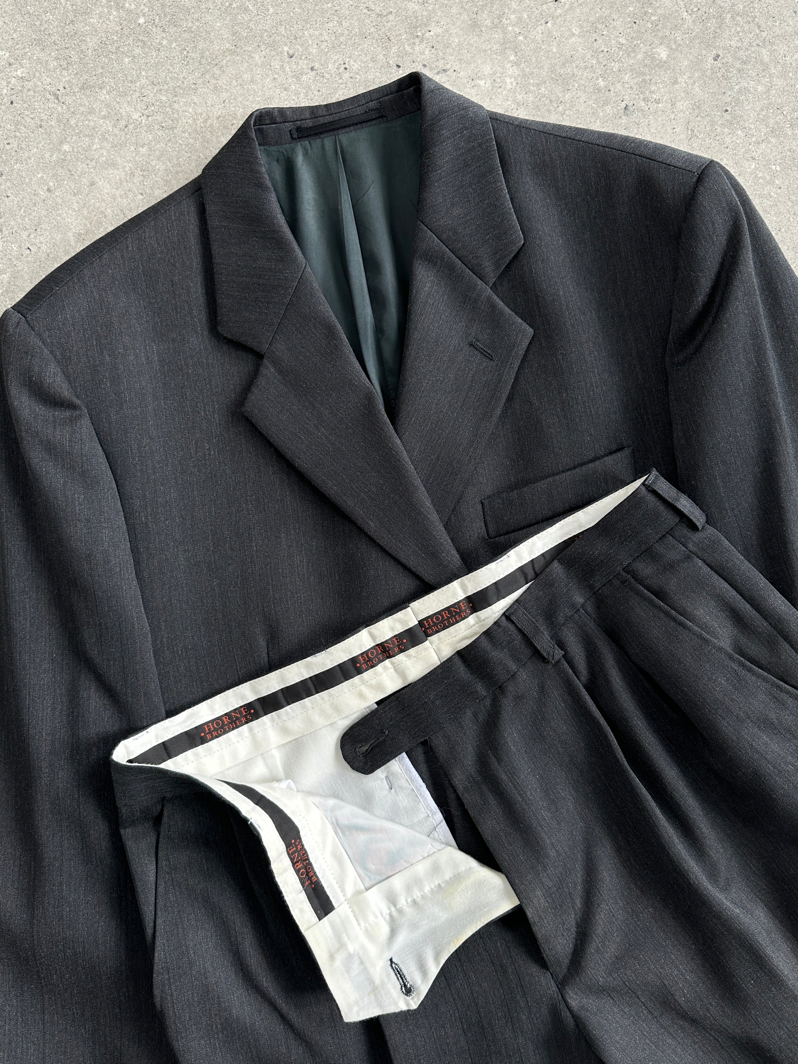 Vintage wool pinstripe single-breasted suit jumpsuit in size 40R/W32, featuring classic tailored design and vintage style.