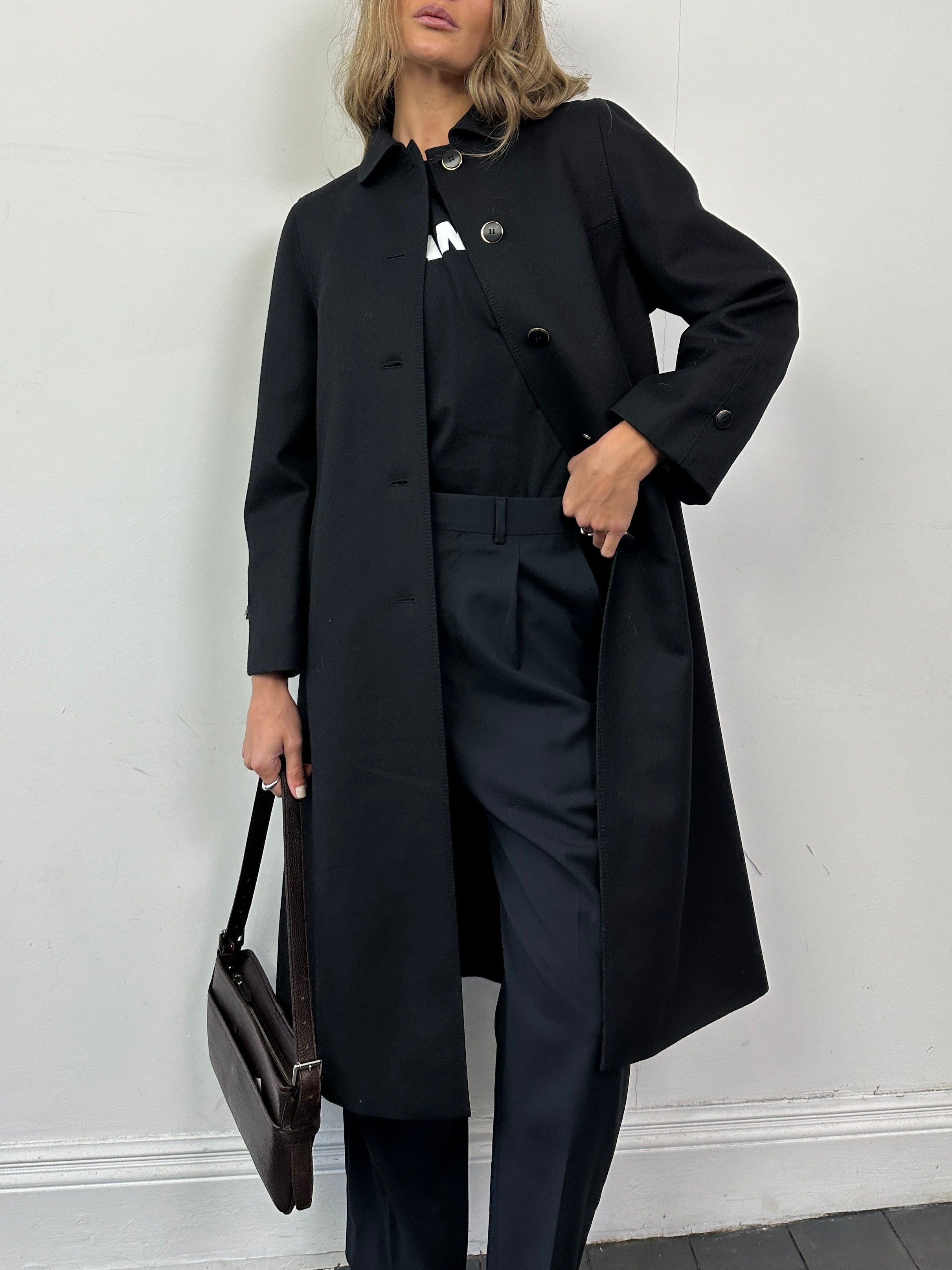 Vintage pure wool single-breasted A-line coat in size small, showcasing classic design and textured wool fabric.