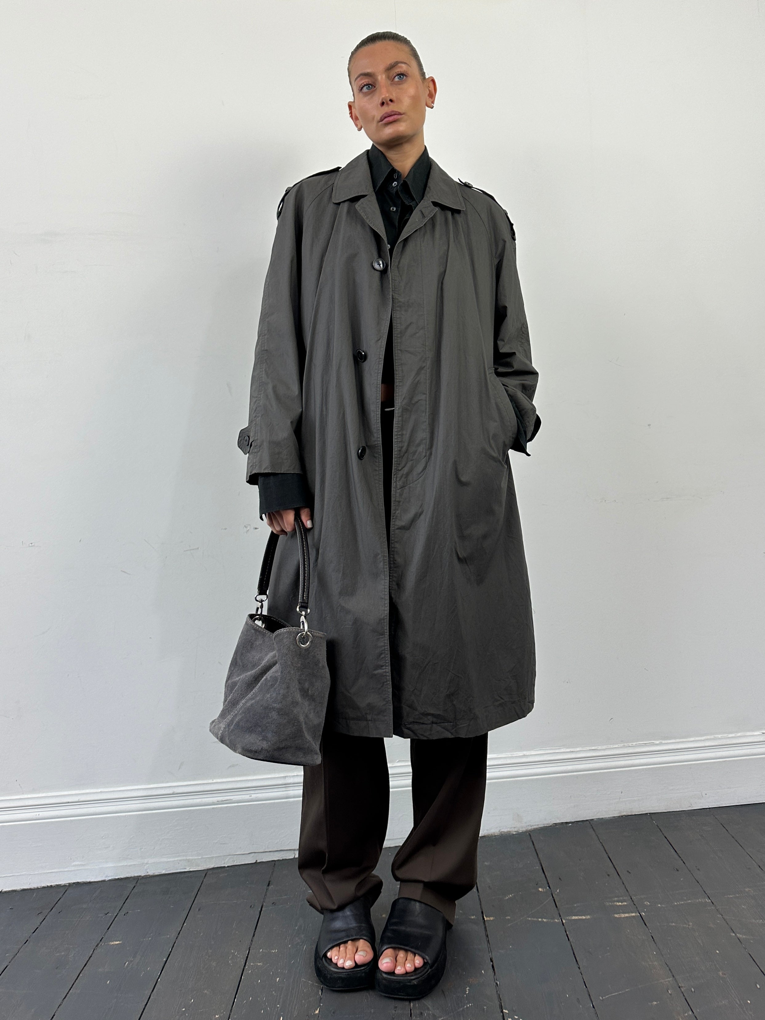 Yves Saint Laurent Pour Homme cotton trench coat with concealed placket in navy, classic men's coat with tailored fit.