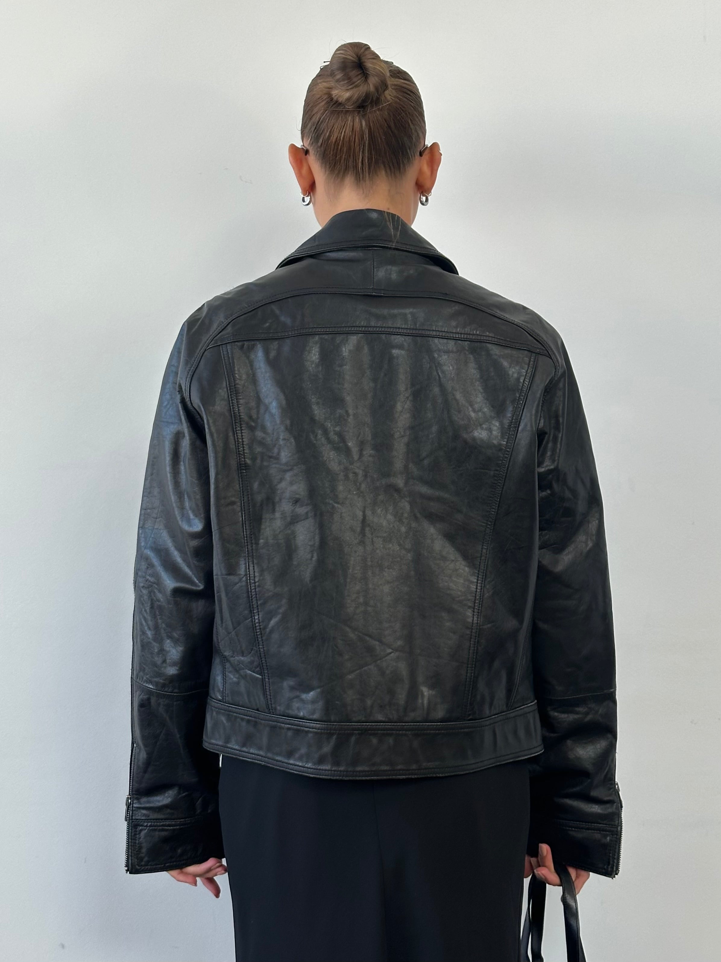 Conbipel high neck leather jacket in size M, featuring a stylish high collar and sleek black leather finish.