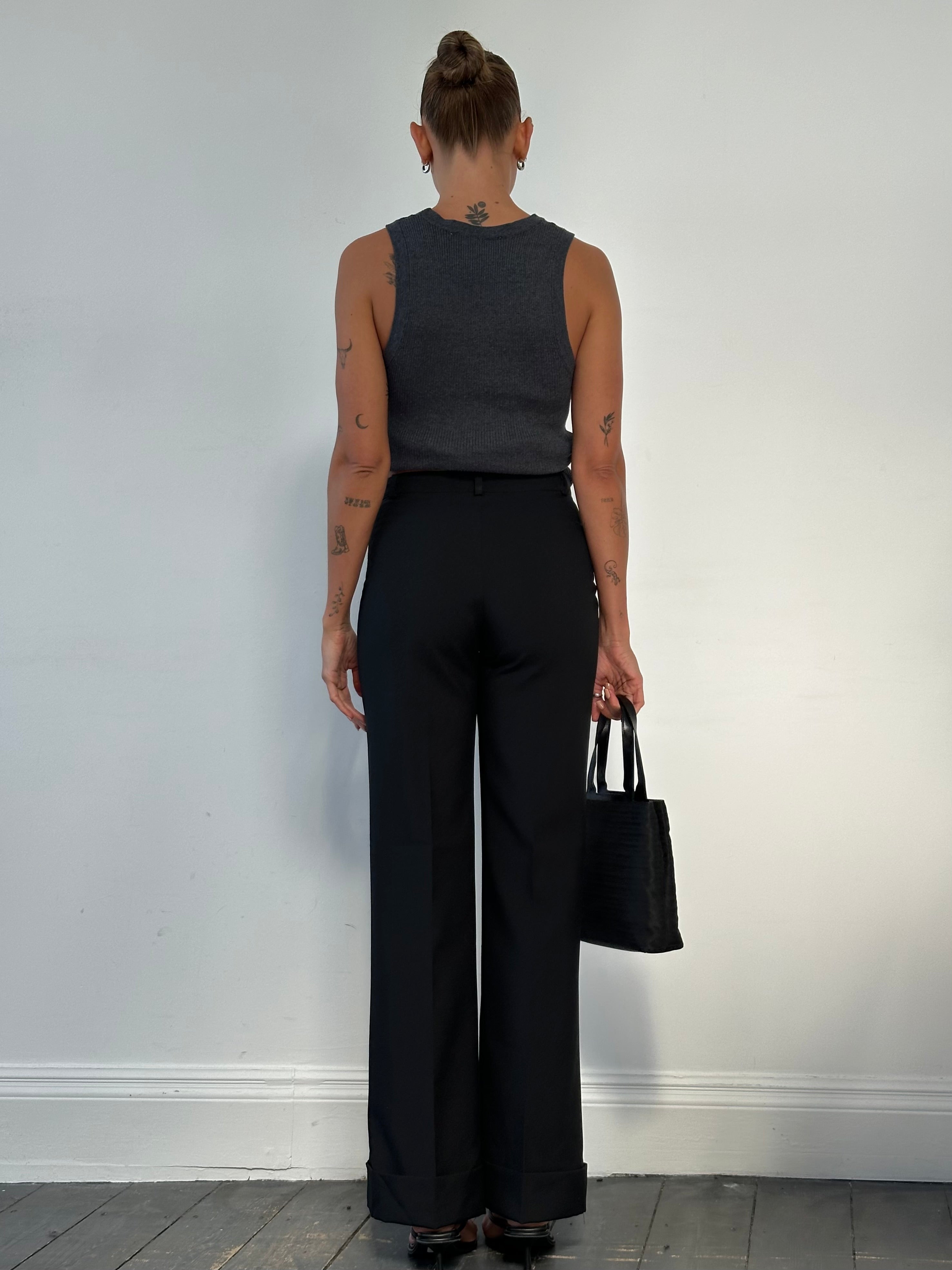 Italian vintage mid-waisted straight-leg tailored trousers in beige with front pockets and belt loops, size W28.