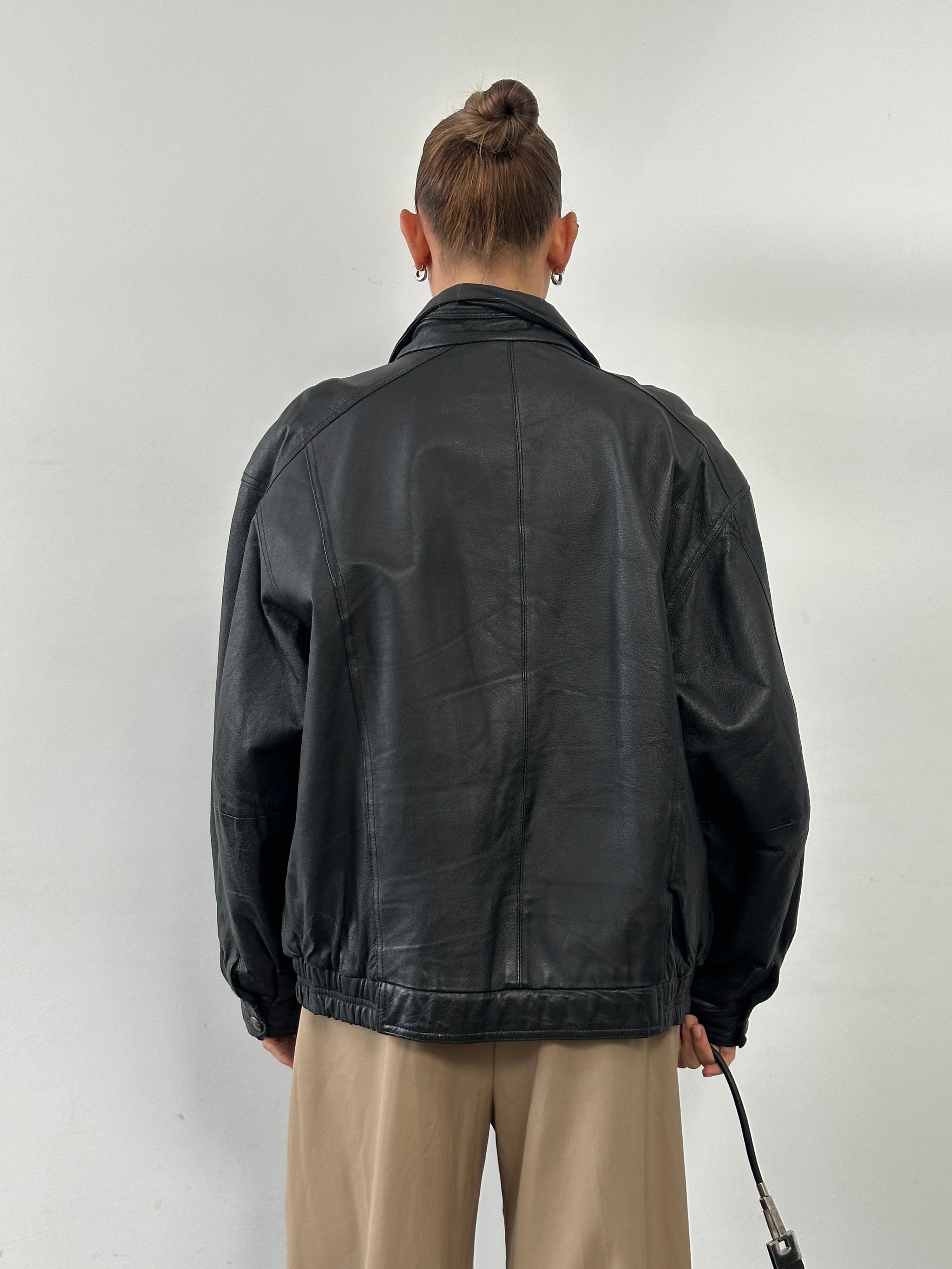 Vintage high neck leather bomber jacket in XL, featuring classic design with smooth leather and ribbed cuffs.