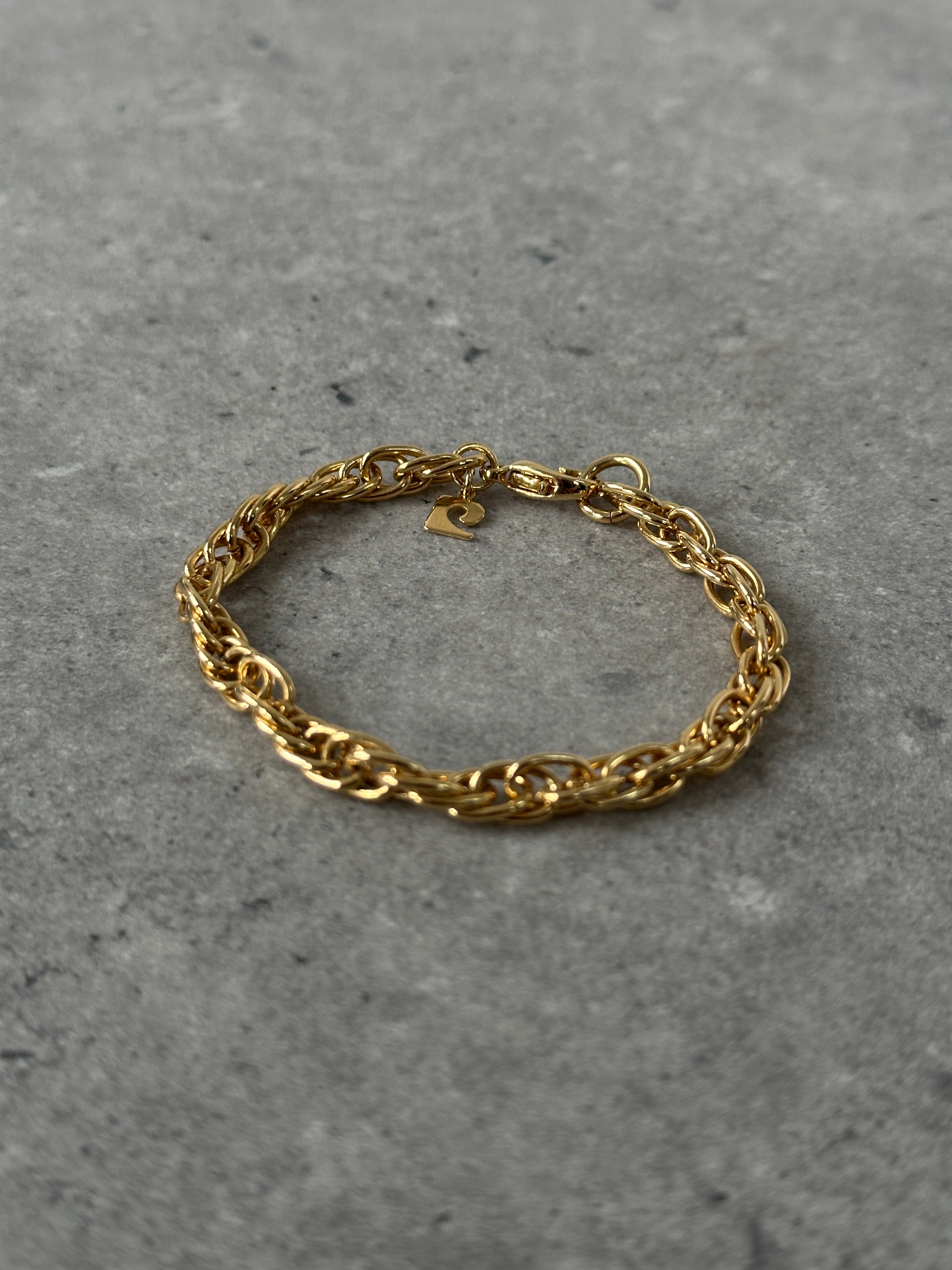 Pierre Cardin gold plated bracelet with sleek design, featuring smooth links and a polished finish.