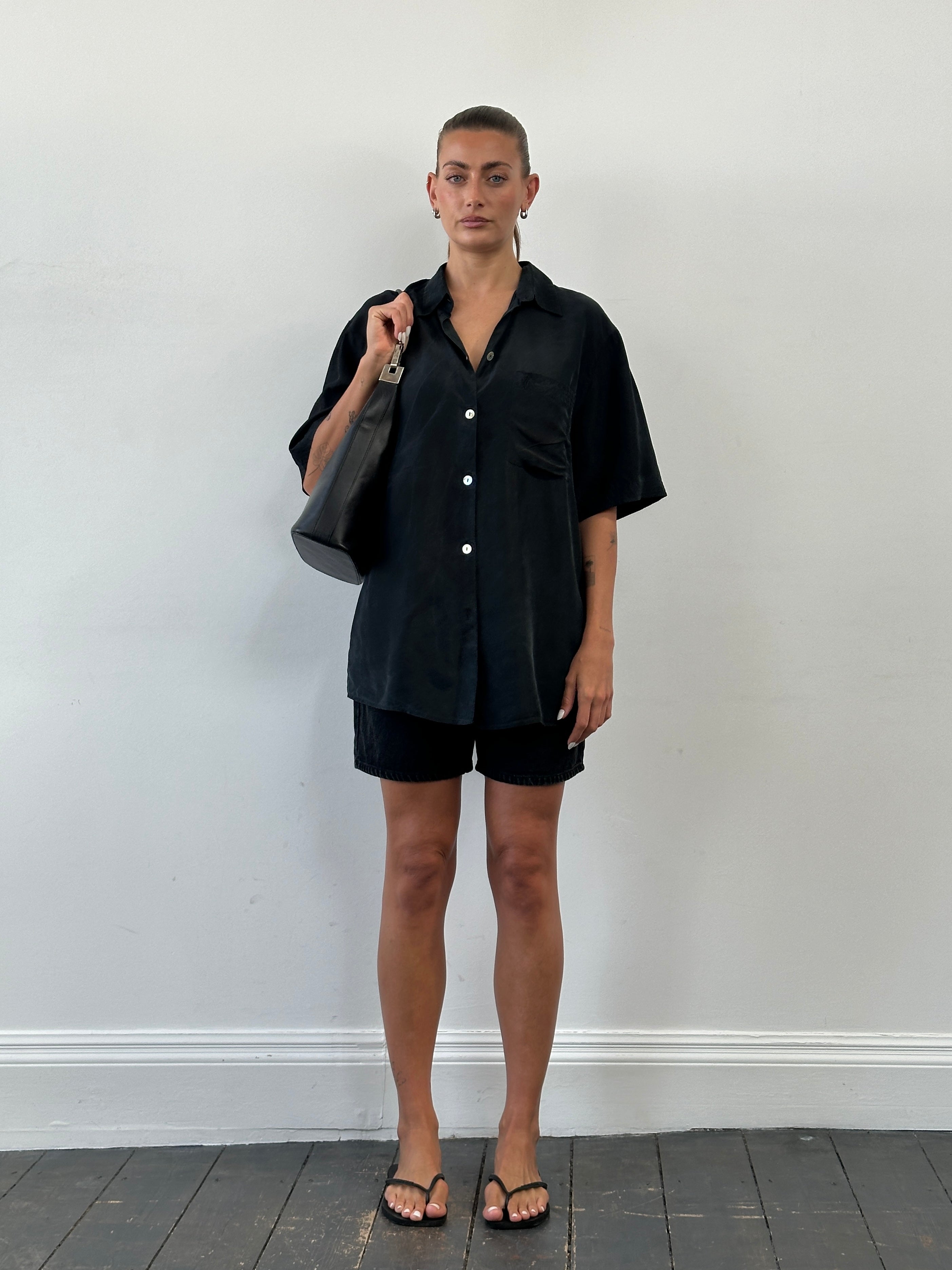 Vintage pure silk short sleeve shirt in size XL, featuring a classic design and smooth fabric, displayed flat on a neutral background.