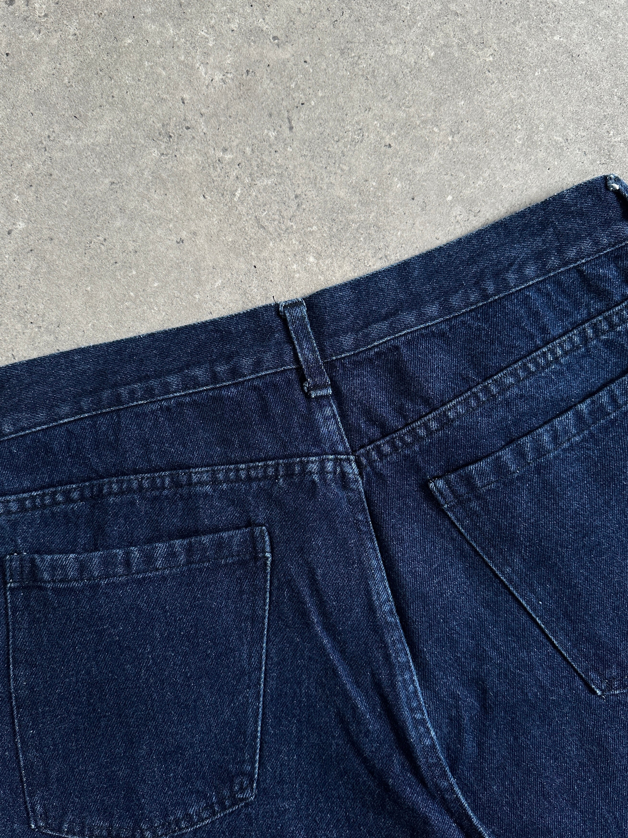 Vintage high waisted straight leg denim jeans, size W30, showcasing classic blue denim with a retro fit and vintage stitching details.