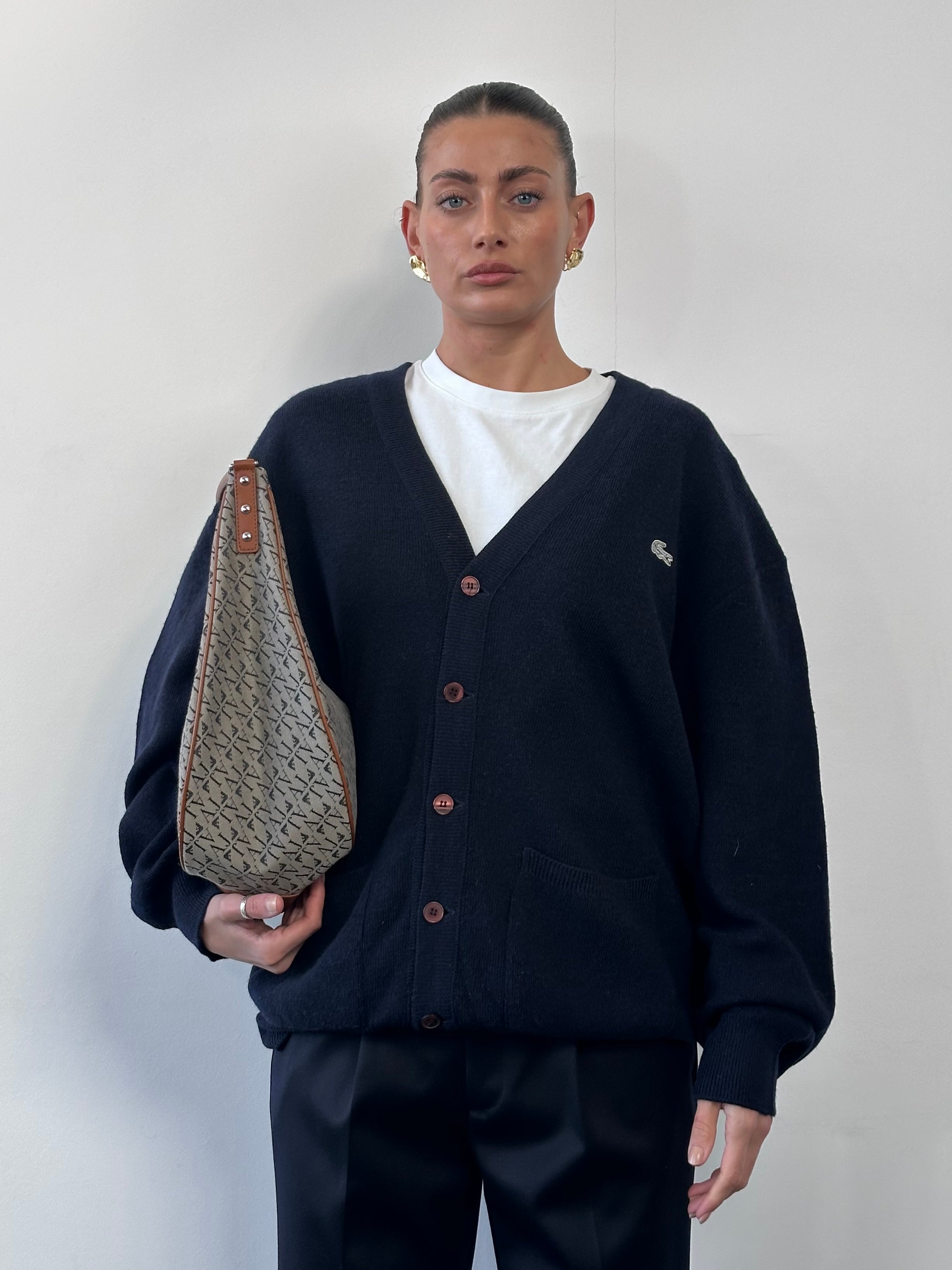 Lacoste wool logo knitted cardigan in XL/XXL, featuring a classic design, button closure, and embroidered brand logo on the chest.