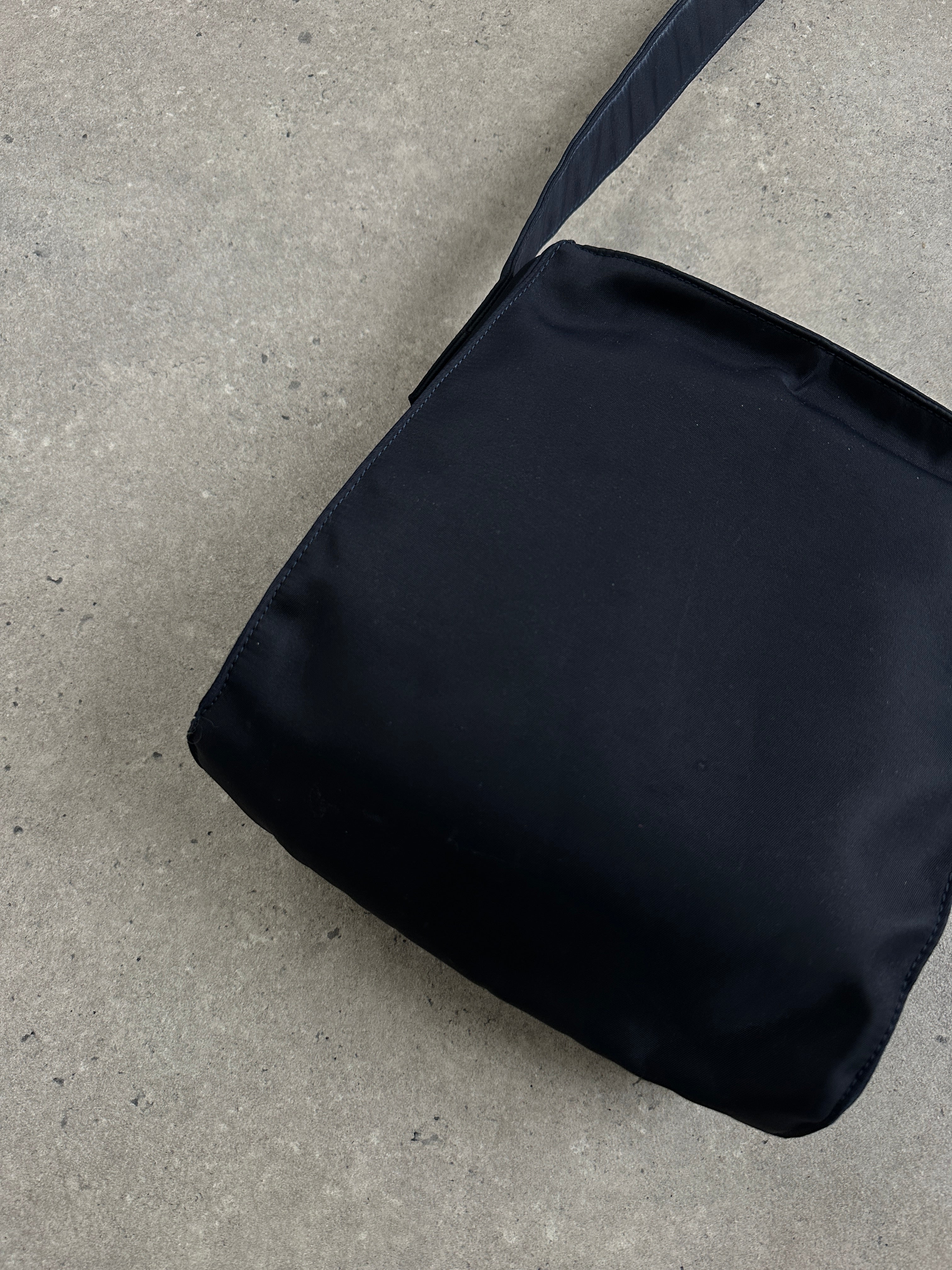 Armani Jeans 2000s nylon shoulder bag with adjustable strap and sleek design, perfect for casual or stylish everyday use.