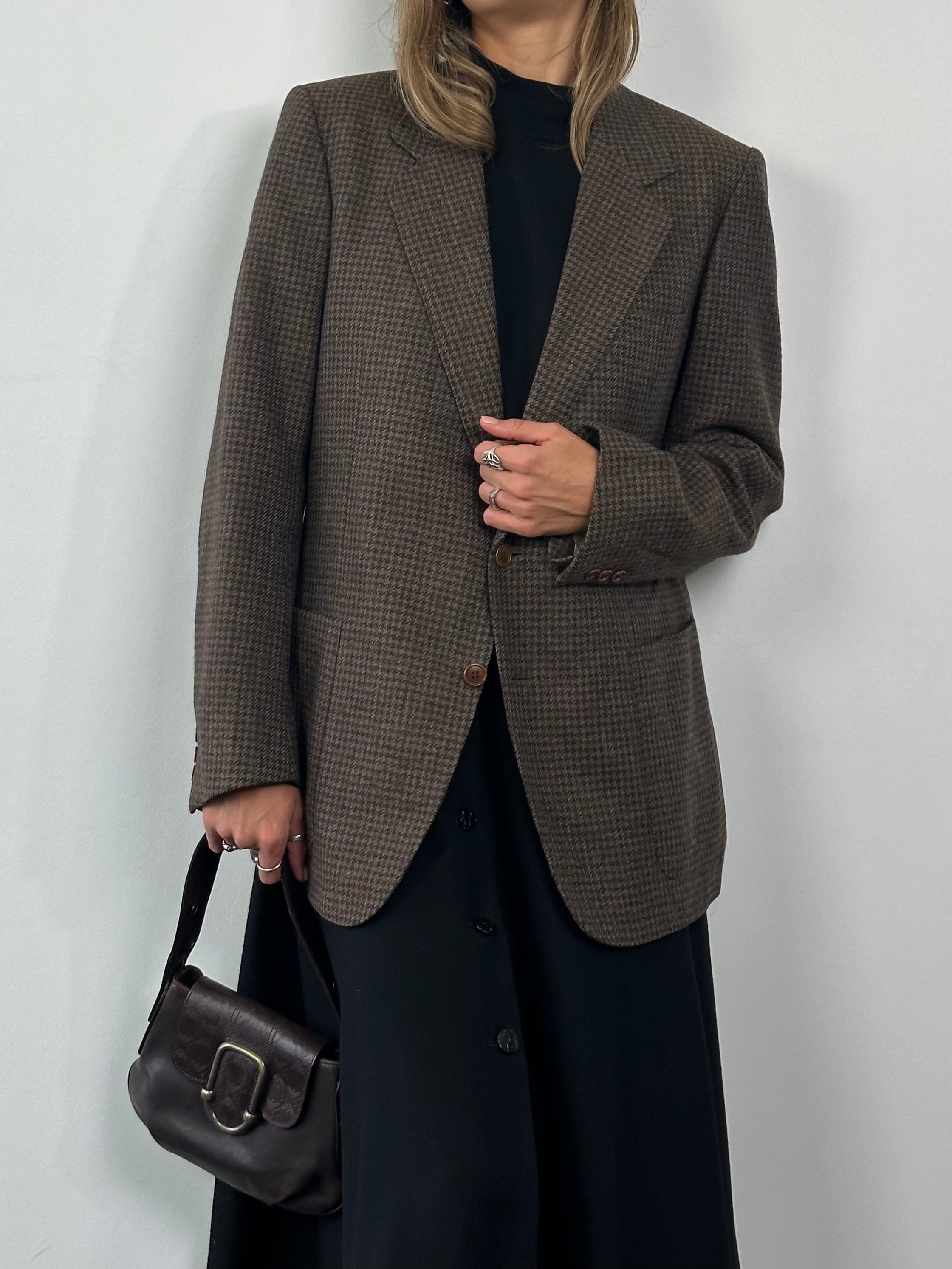 Yves Saint Laurent circa 80s wool tweed single-breasted blazer in size L, featuring classic tailored design and textured fabric.